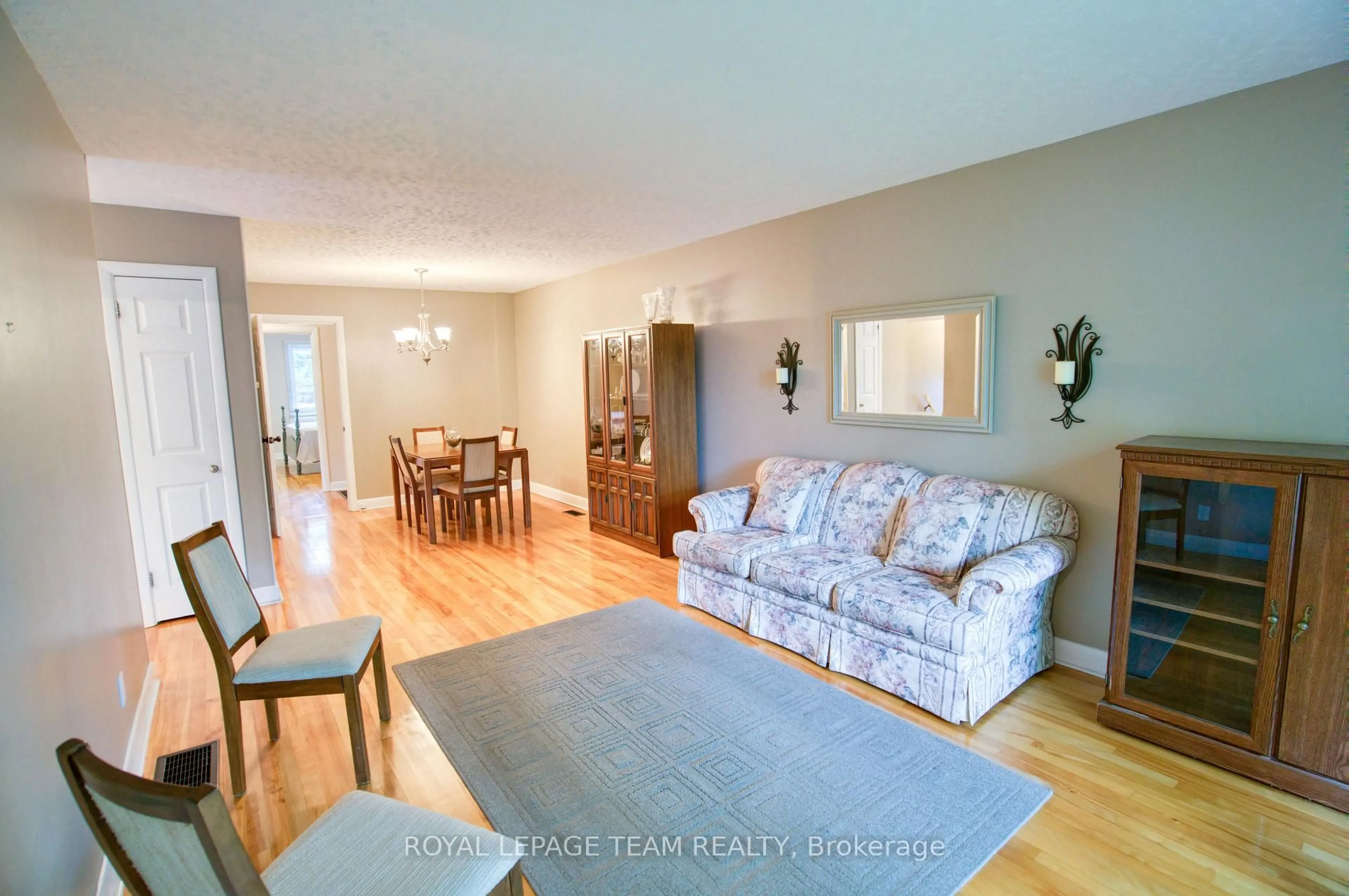 Living room with furniture, wood/laminate floor for 1072 Aldea Ave, Ottawa Ontario K1H 8B9