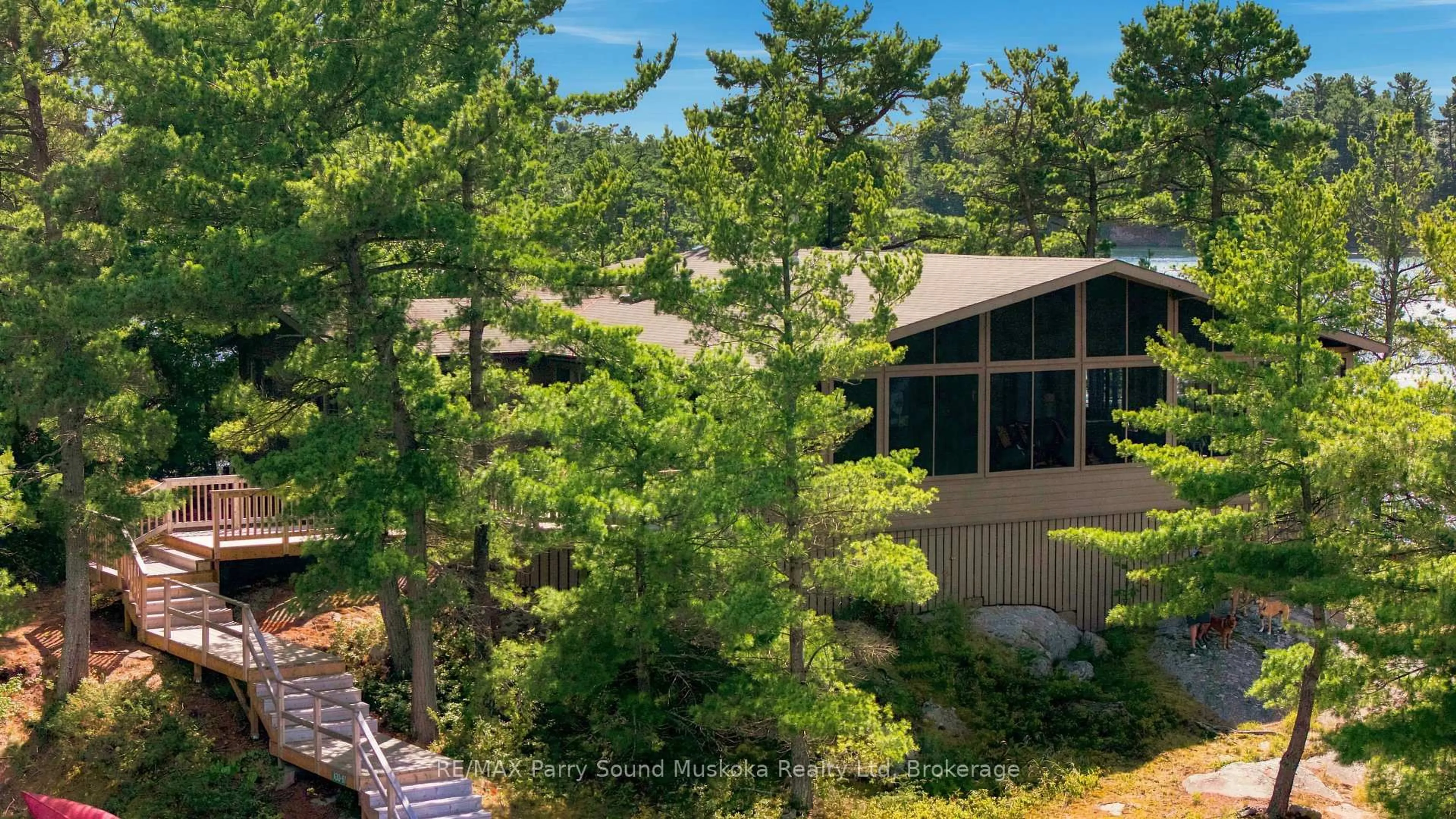 A pic from outside/outdoor area/front of a property/back of a property/a pic from drone, forest/trees view for 87 Island Island, The Archipelago Ontario P0G 1K0