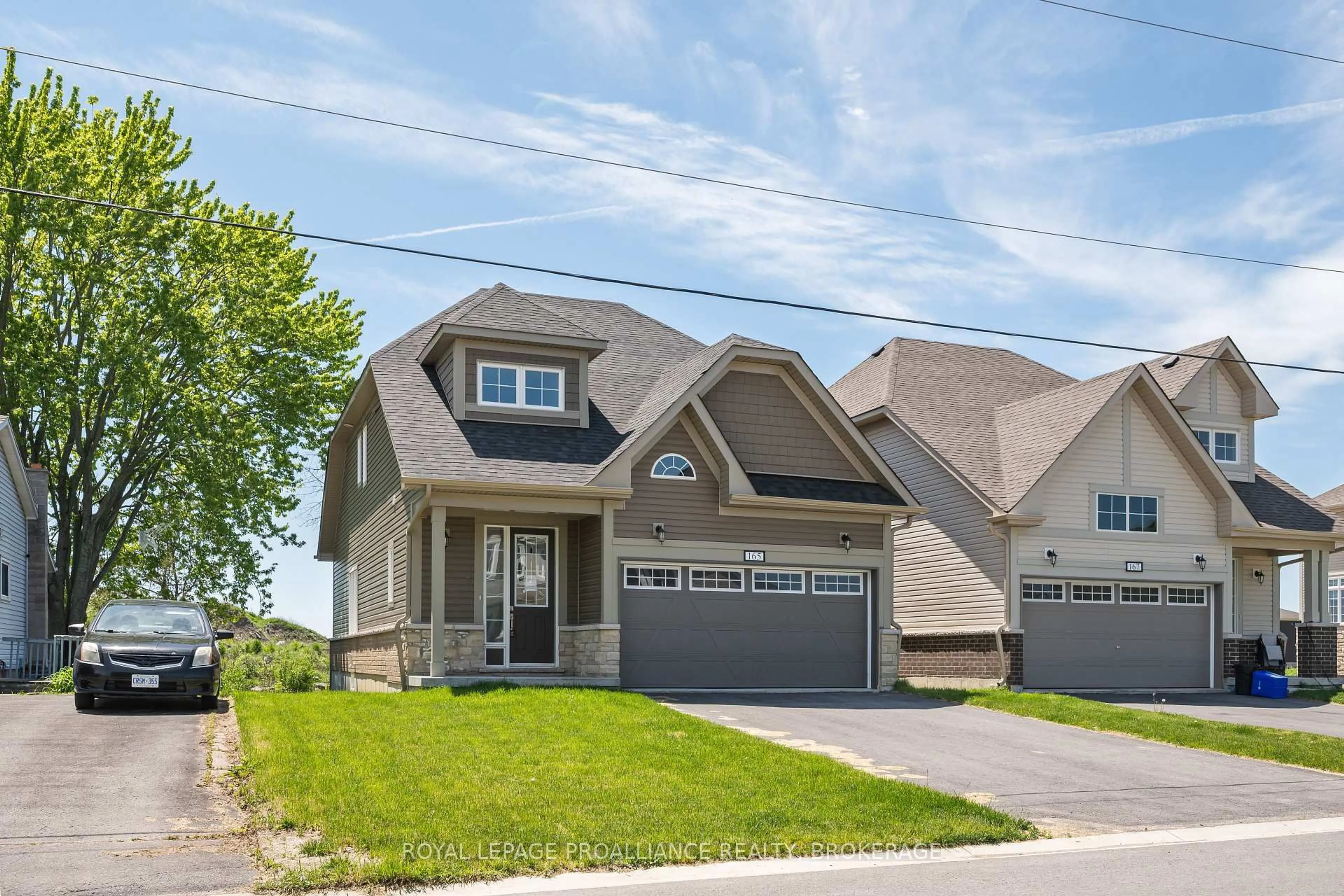 Home with vinyl exterior material, street for 165 Purdy Rd, Bath Ontario K0H 1G0