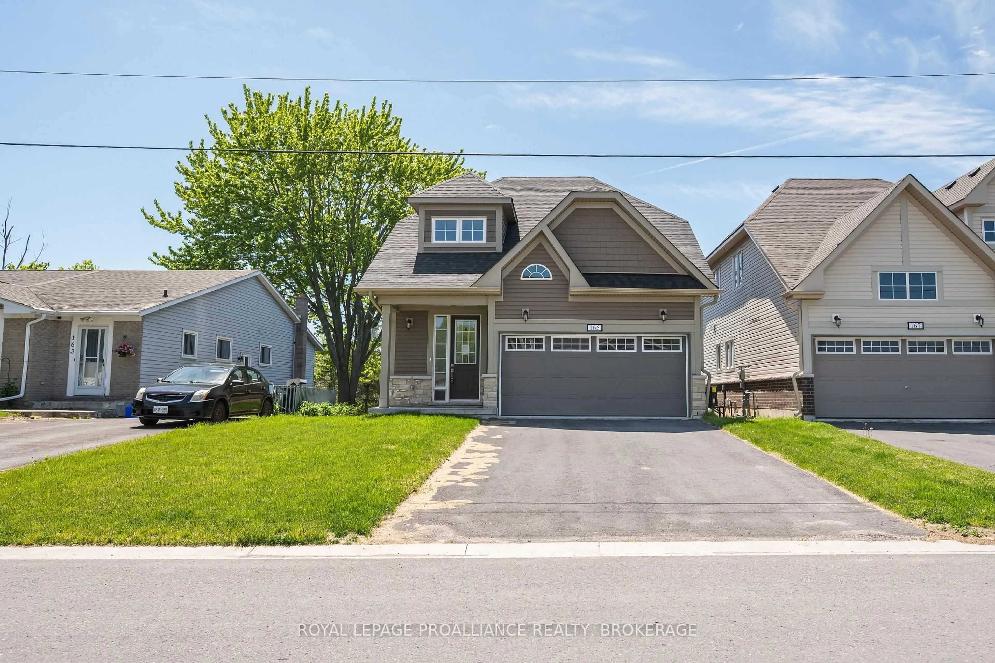 Home with vinyl exterior material, street for 165 Purdy Rd, Bath Ontario K0H 1G0
