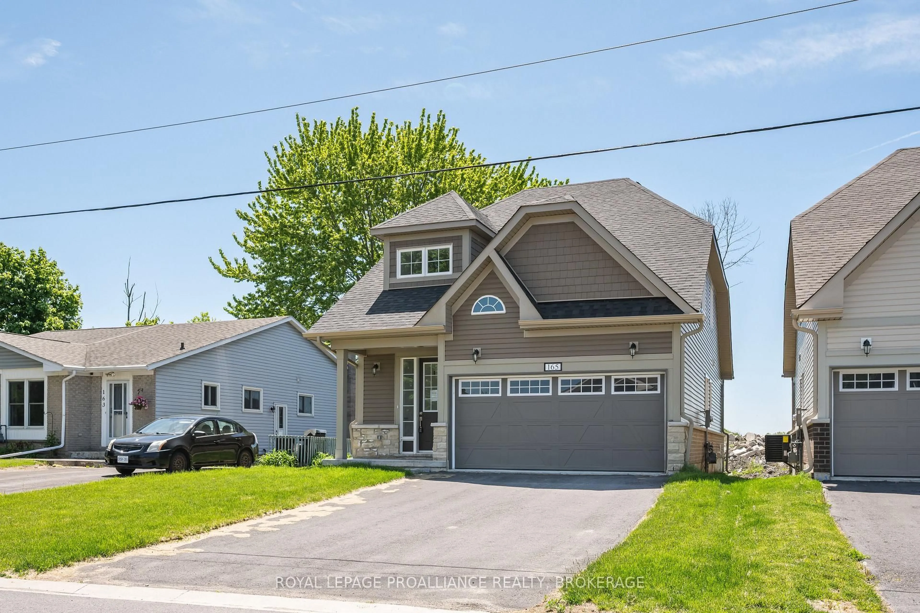 Home with vinyl exterior material, street for 165 Purdy Rd, Bath Ontario K0H 1G0