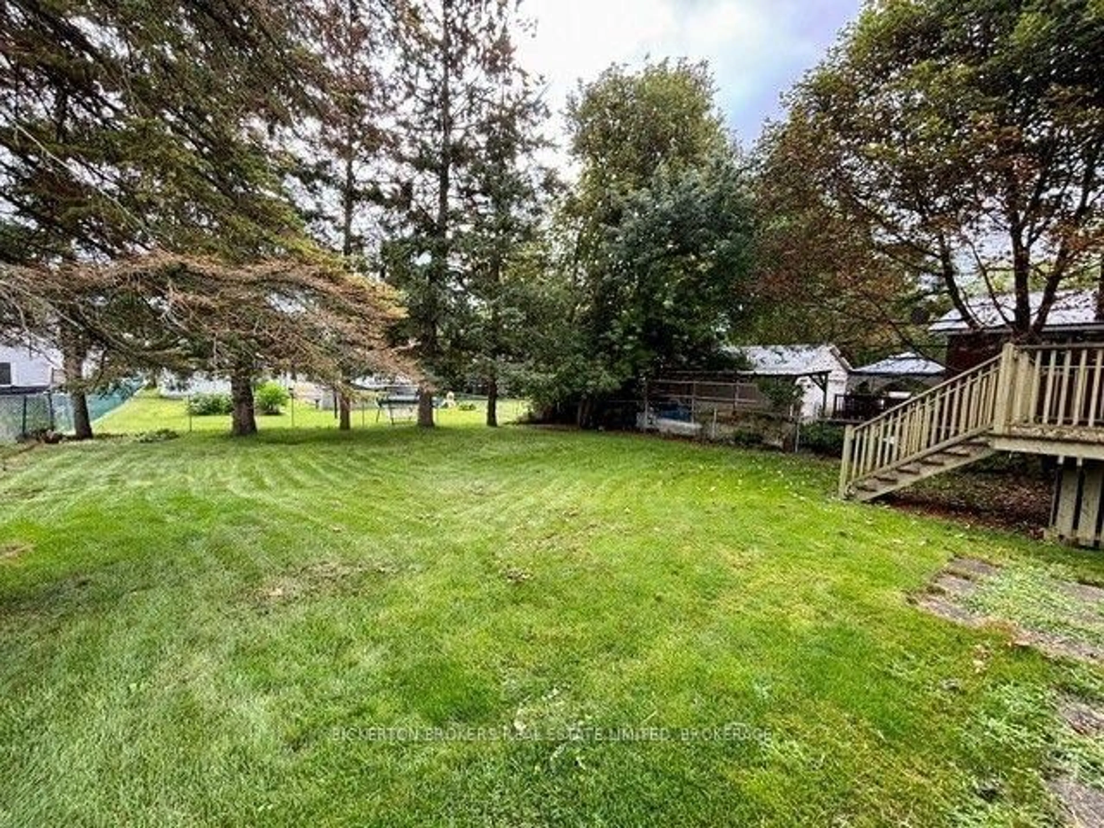 A pic from outside/outdoor area/front of a property/back of a property/a pic from drone, forest/trees view for 355 Oak St, Gananoque Ontario K7G 2R7