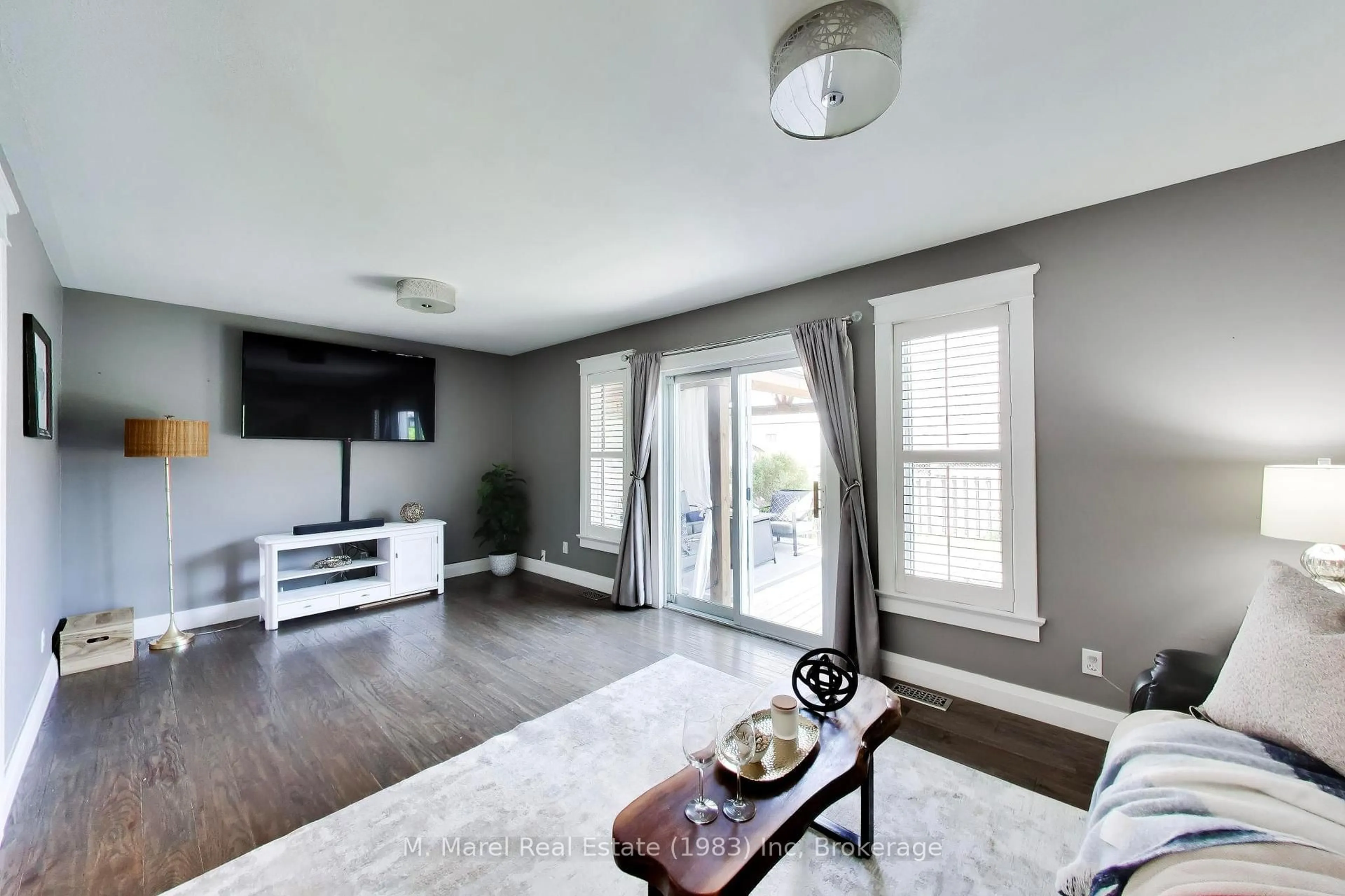 Living room with furniture, wood/laminate floor for 38 Udell Way, Grimsby Ontario L3M 5L3