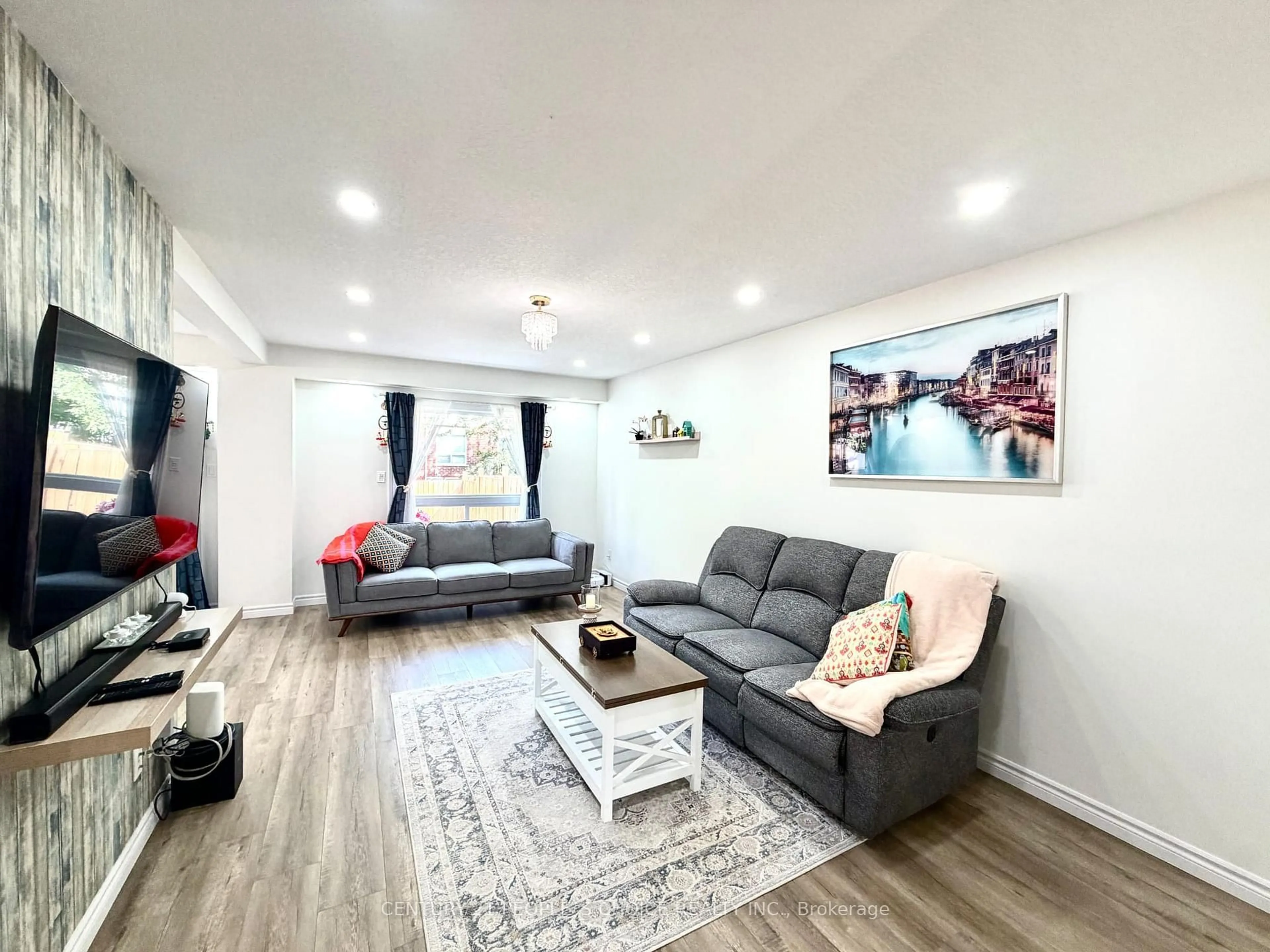 Living room with furniture, wood/laminate floor for 504 Doon Dr, Kitchener Ontario N2P 2Z1