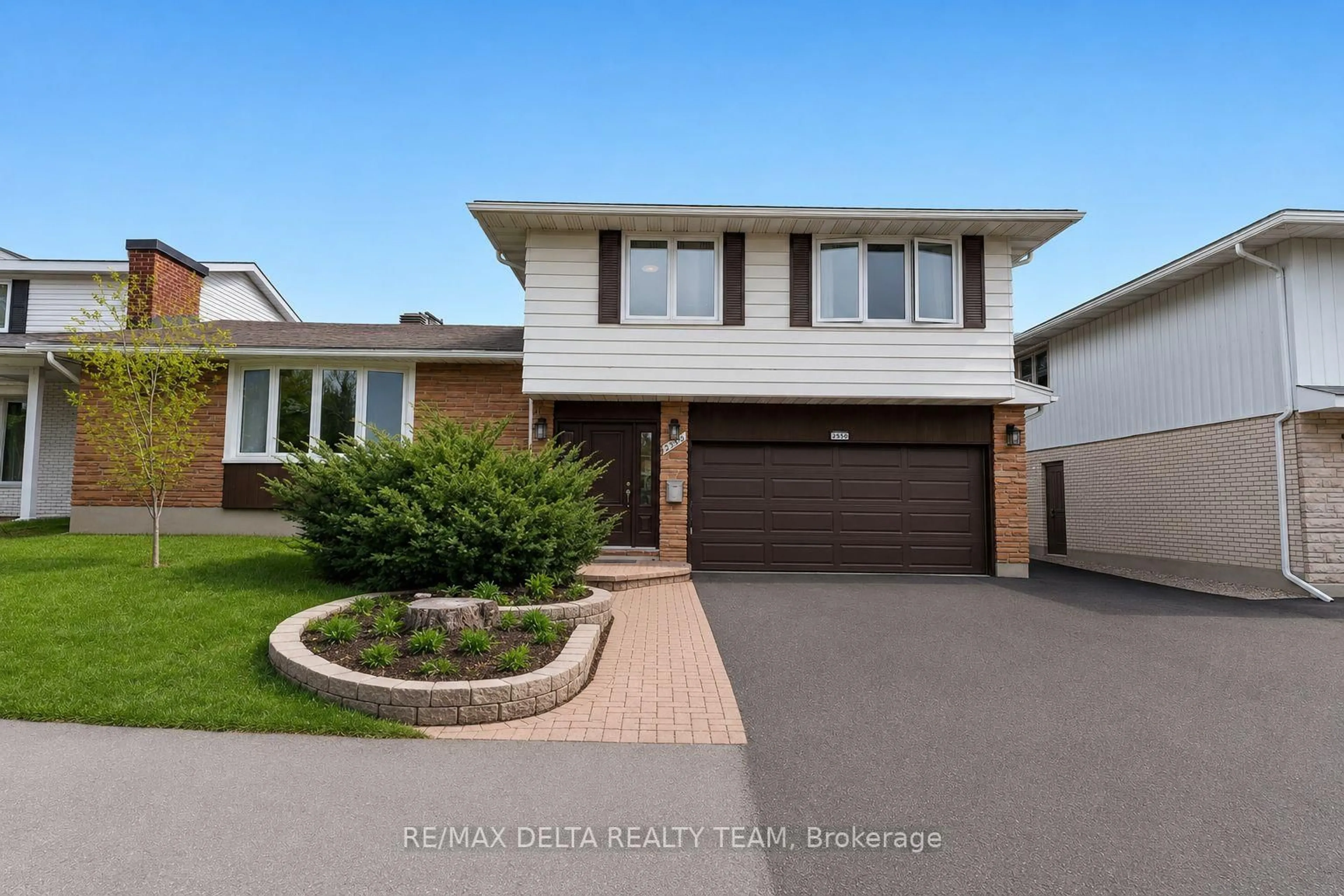 Home with vinyl exterior material, street for 2350 Georgina Dr, Ottawa Ontario K2B 7M5