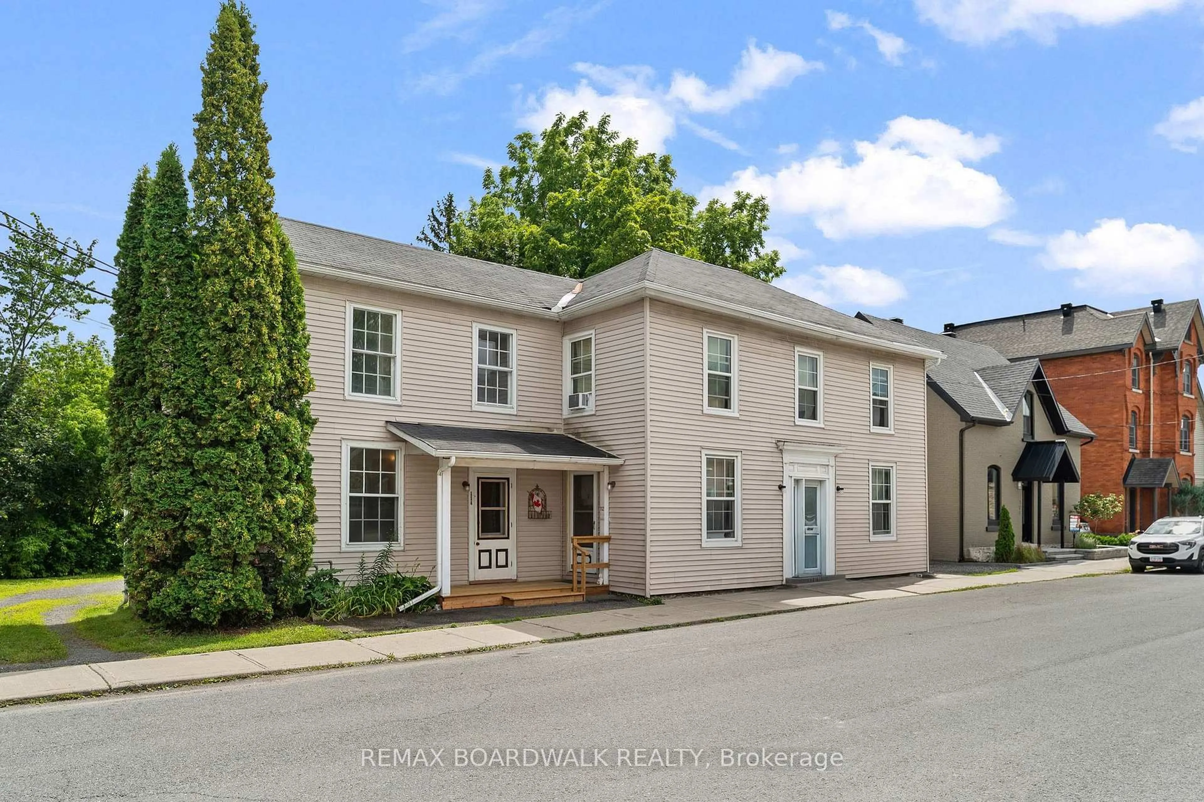 A pic from outside/outdoor area/front of a property/back of a property/a pic from drone, street for 110-114 Clothier St, North Grenville Ontario K0G 1J0