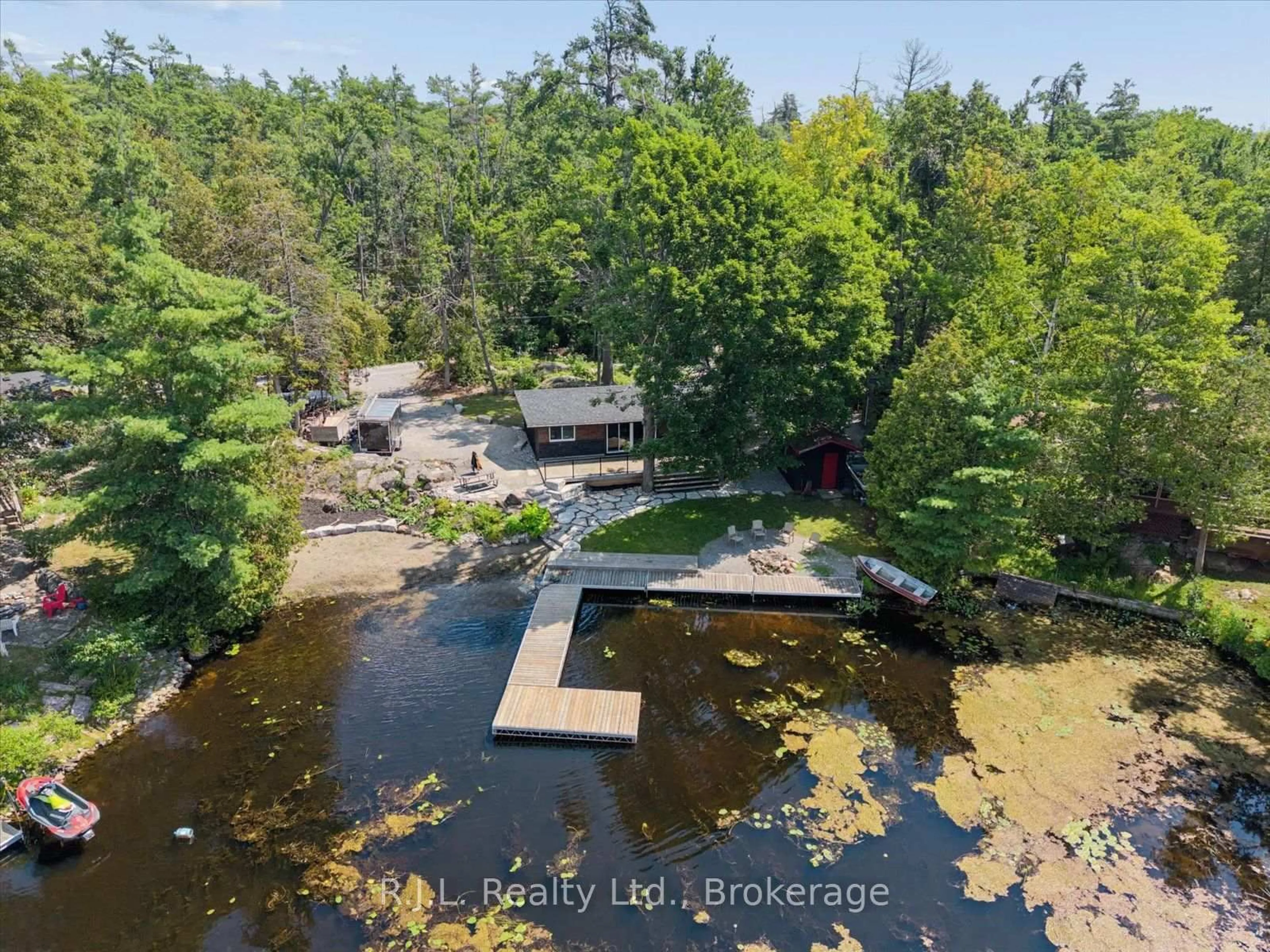 A pic from outside/outdoor area/front of a property/back of a property/a pic from drone, water/lake/river/ocean view for 14 Deer Bay Reach Rd, Trent Lakes Ontario K0L 1J0