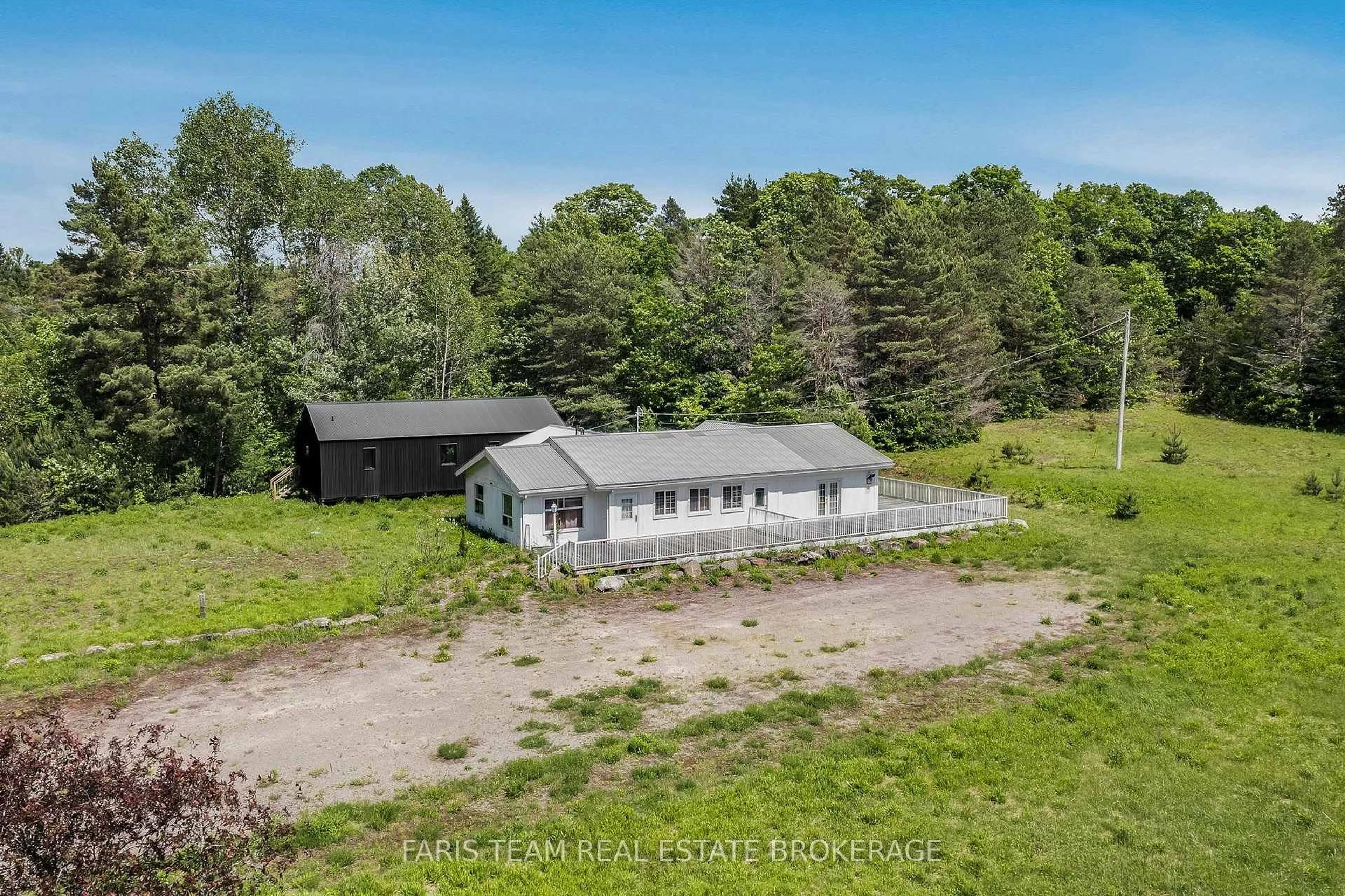 A pic from outside/outdoor area/front of a property/back of a property/a pic from drone, unknown for 2180-2186 Highway 141, Muskoka Lakes Ontario P0B 1L0