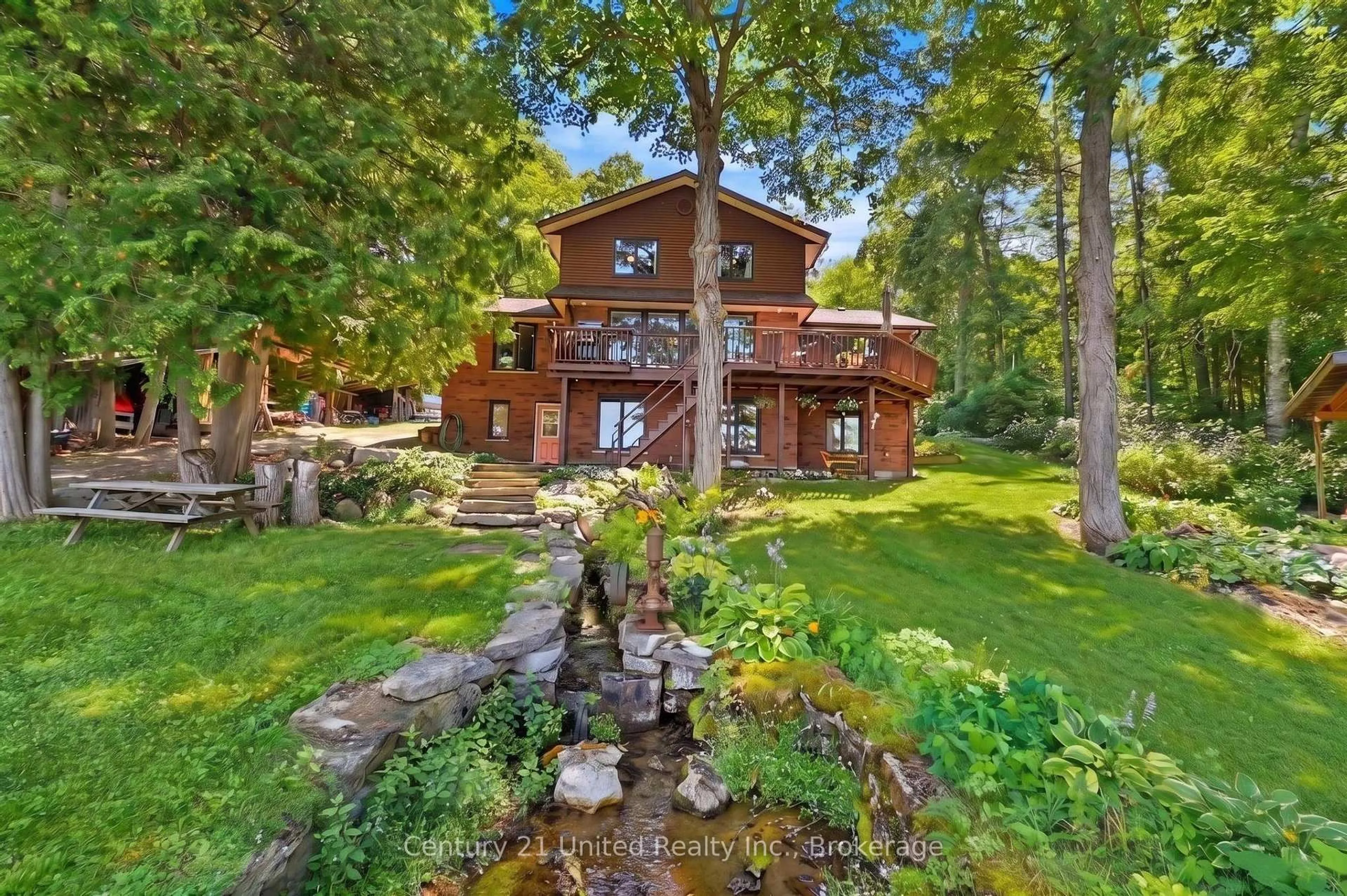 A pic from outside/outdoor area/front of a property/back of a property/a pic from drone, water/lake/river/ocean view for 113 Sugarbush Cres, Trent Lakes Ontario K0L 1J0