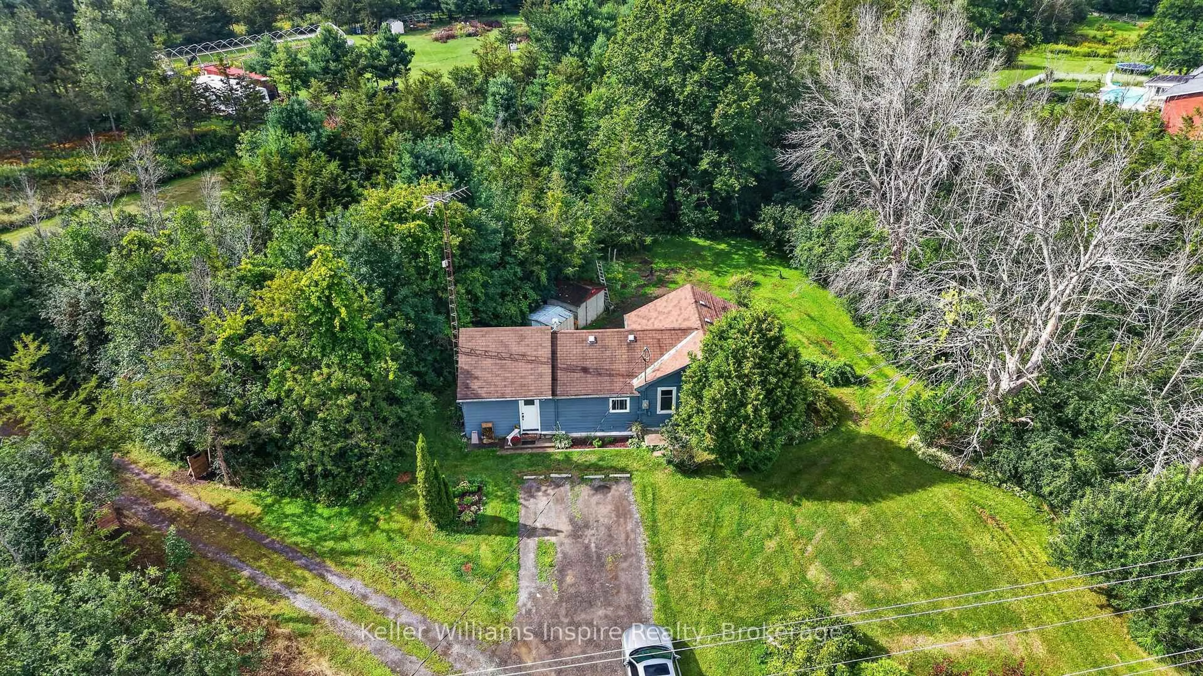 A pic from outside/outdoor area/front of a property/back of a property/a pic from drone, street for 7968 County 2 Rd, Napanee Ontario K7R 3K6