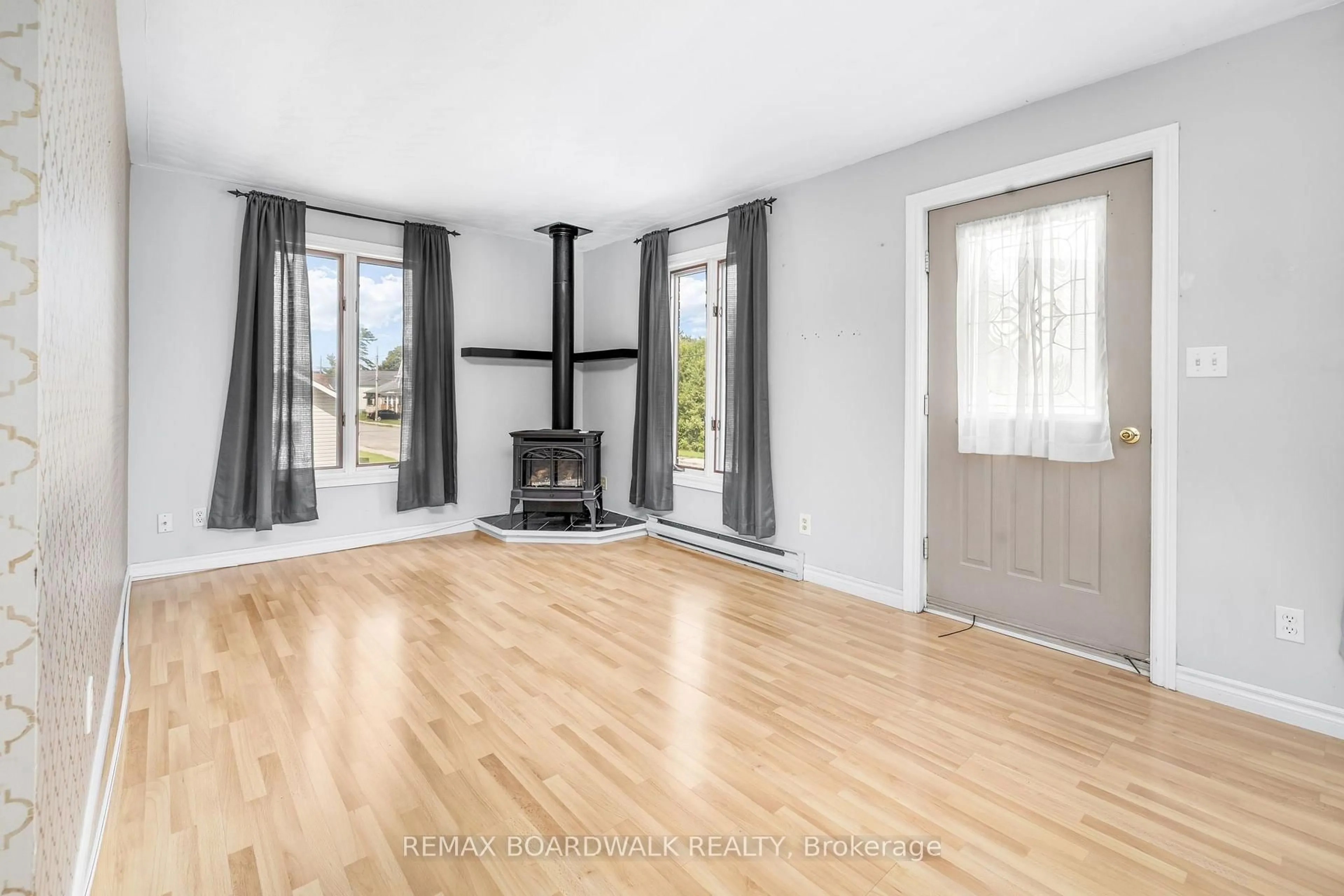 Living room with furniture, wood/laminate floor for 22 Merrick St, Smiths Falls Ontario K7A 4R4