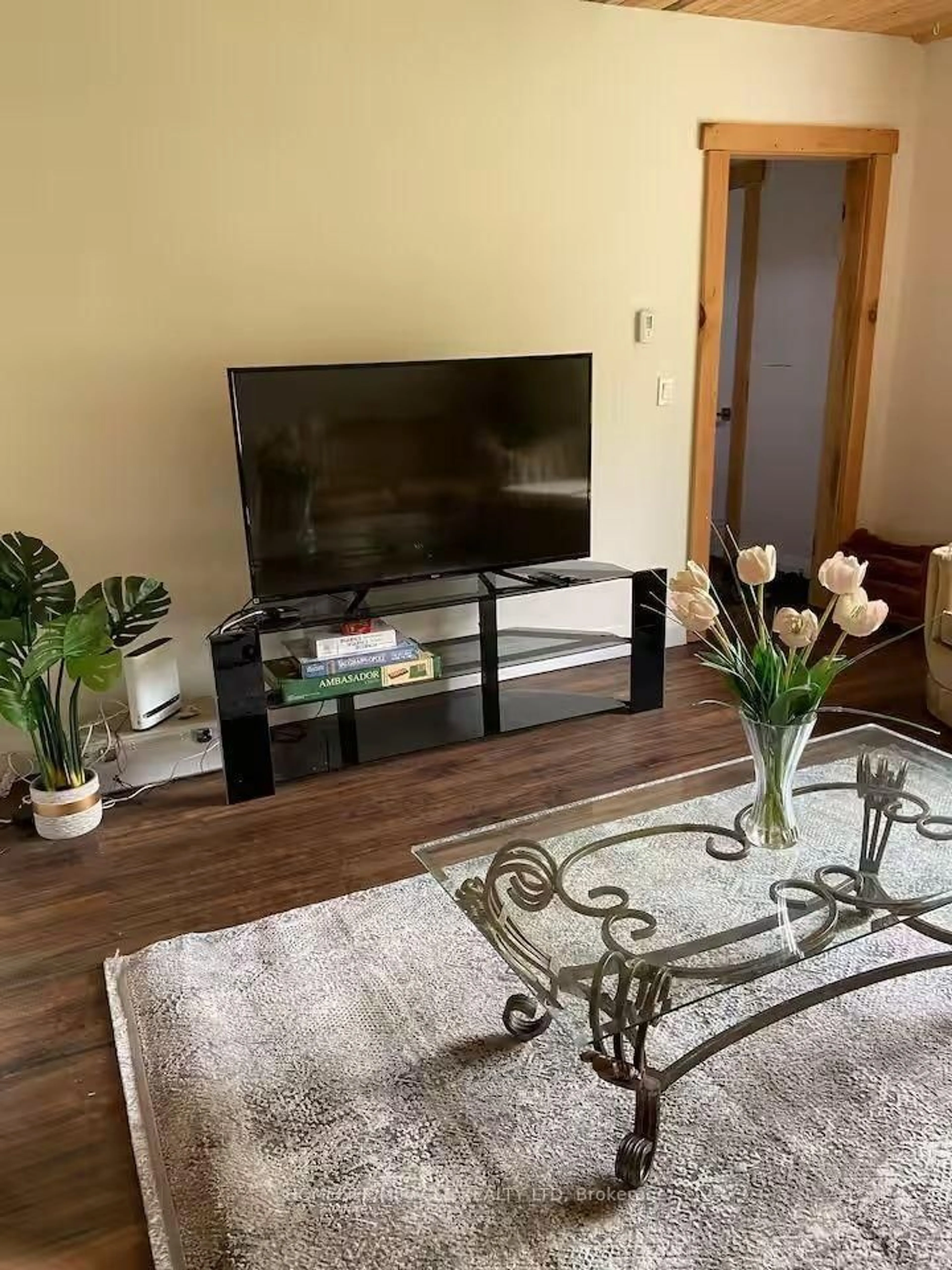 Living room with furniture, wood/laminate floor for 68 Bridge St, Bancroft Ontario K0L 1C0