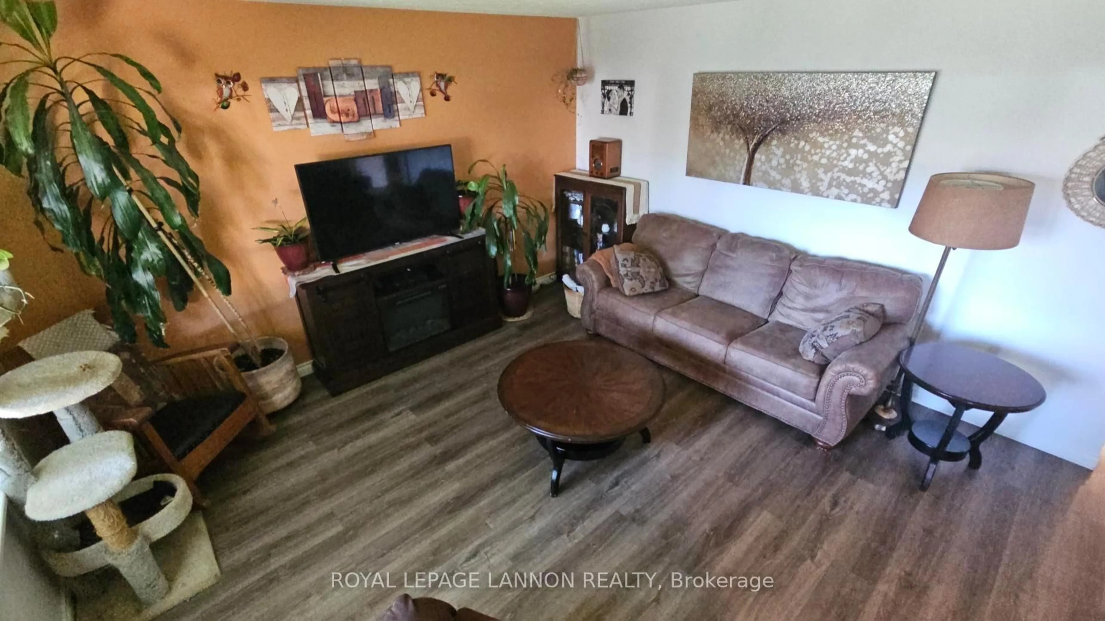 Living room with furniture, wood/laminate floor for 1820 Hamilton Ave, Thunder Bay Ontario P7E 4Y1