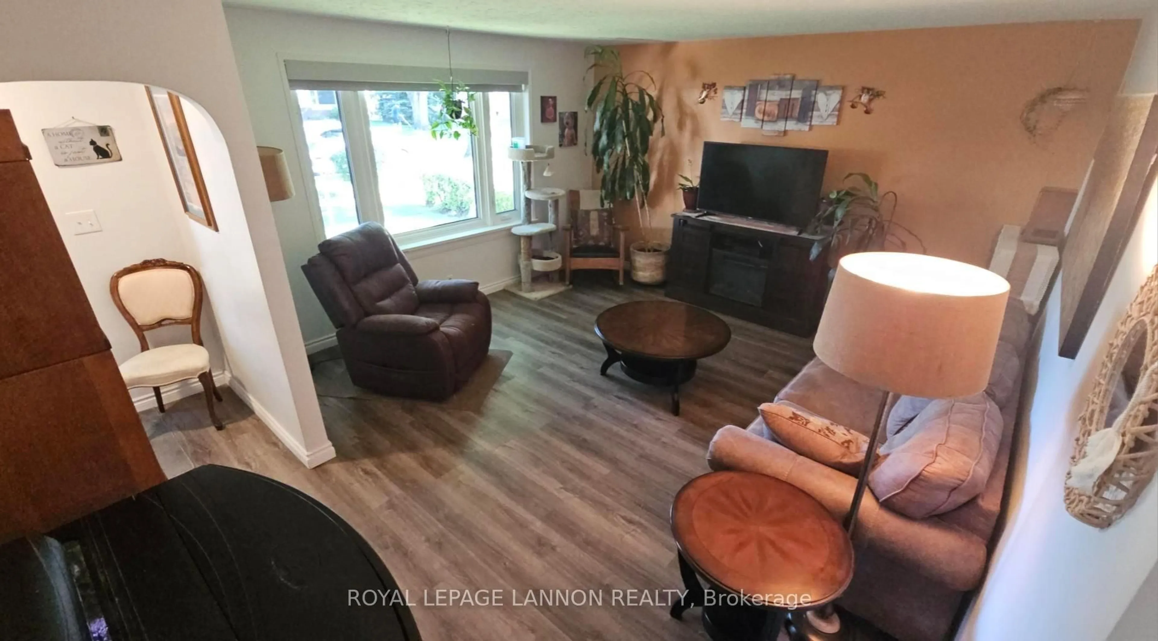 Living room with furniture, wood/laminate floor for 1820 Hamilton Ave, Thunder Bay Ontario P7E 4Y1