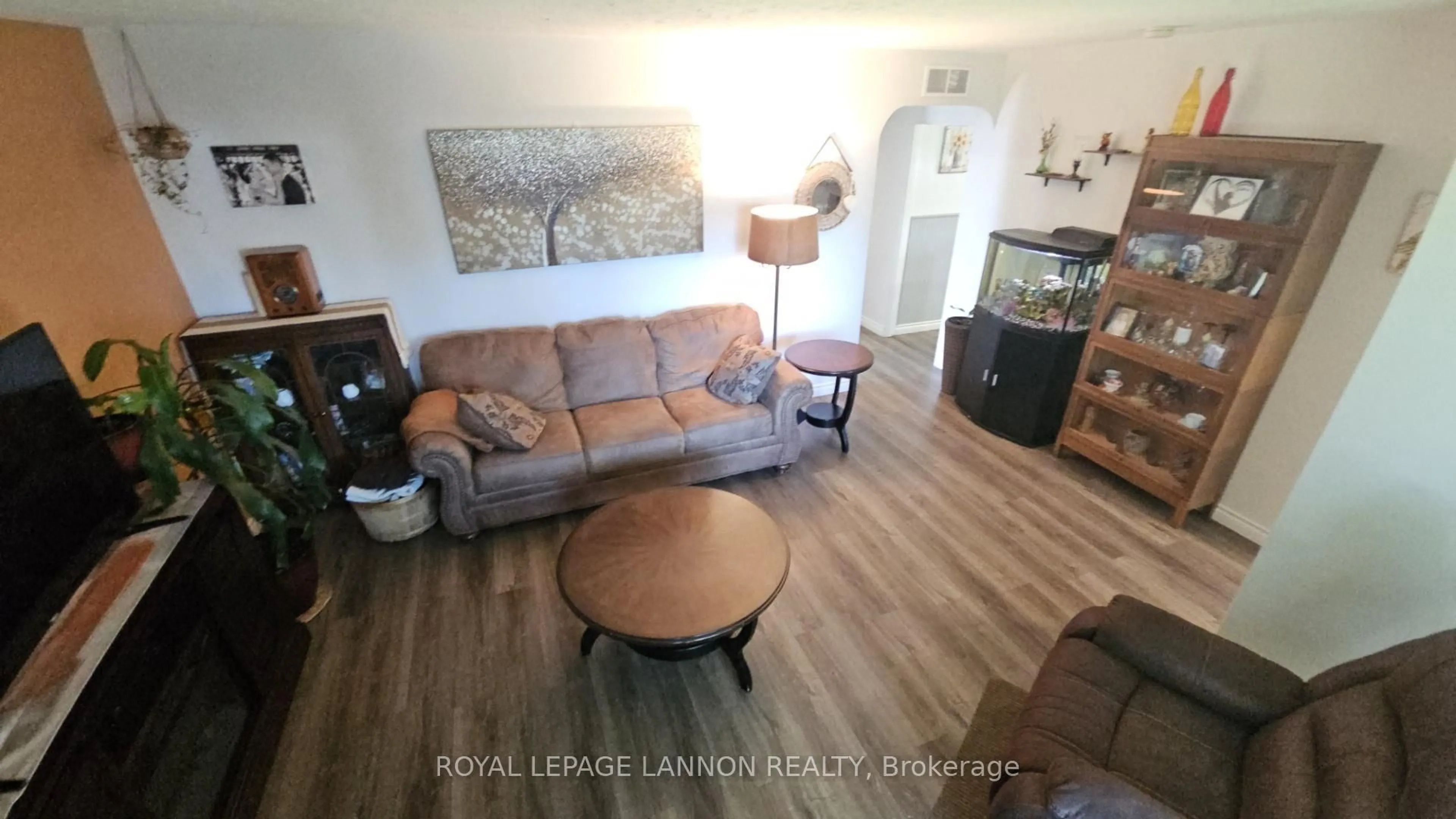 Living room with furniture, wood/laminate floor for 1820 Hamilton Ave, Thunder Bay Ontario P7E 4Y1