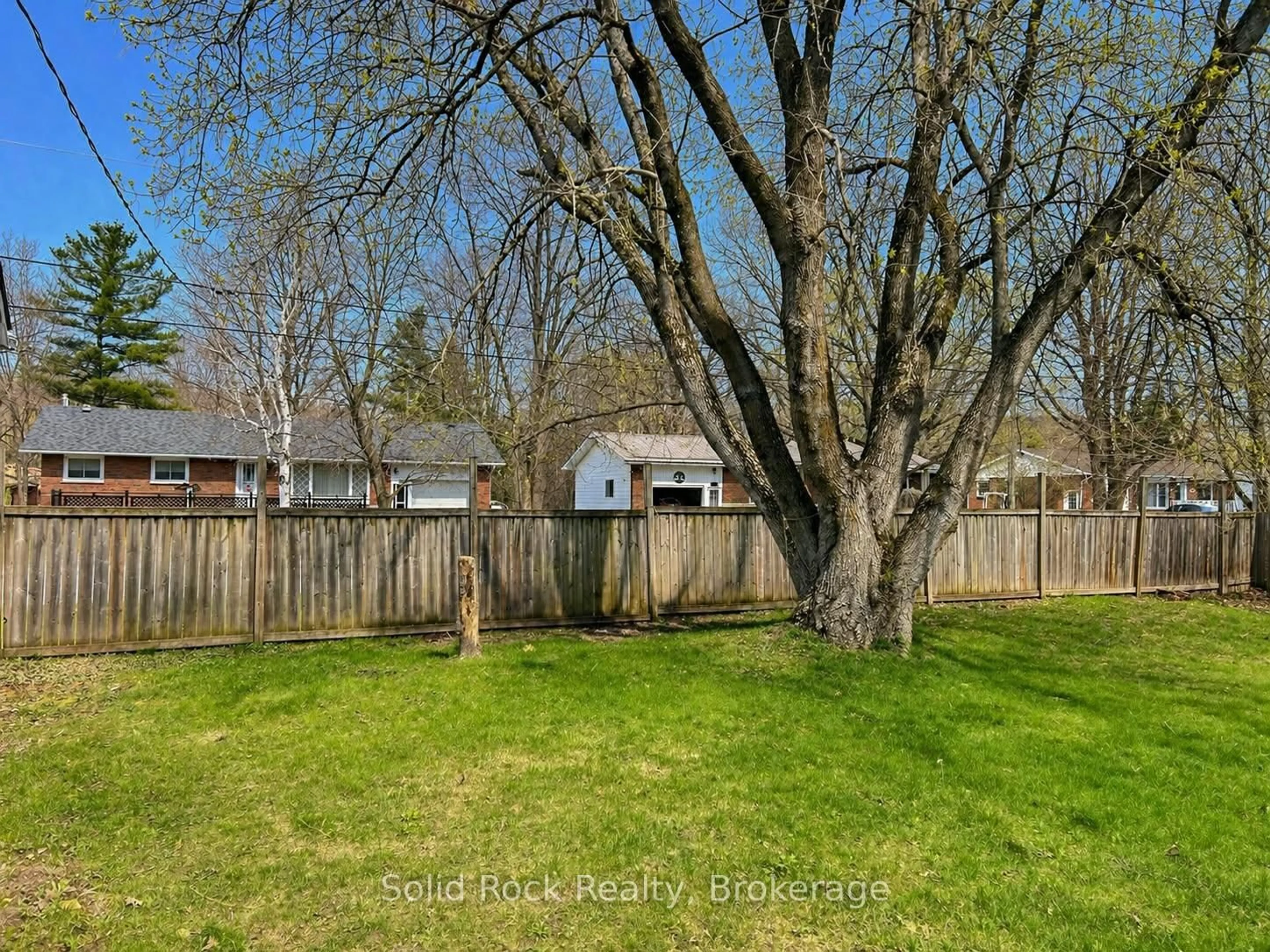 A pic from outside/outdoor area/front of a property/back of a property/a pic from drone, forest/trees view for 14 Linn St, Limoges Ontario K0K 2M0