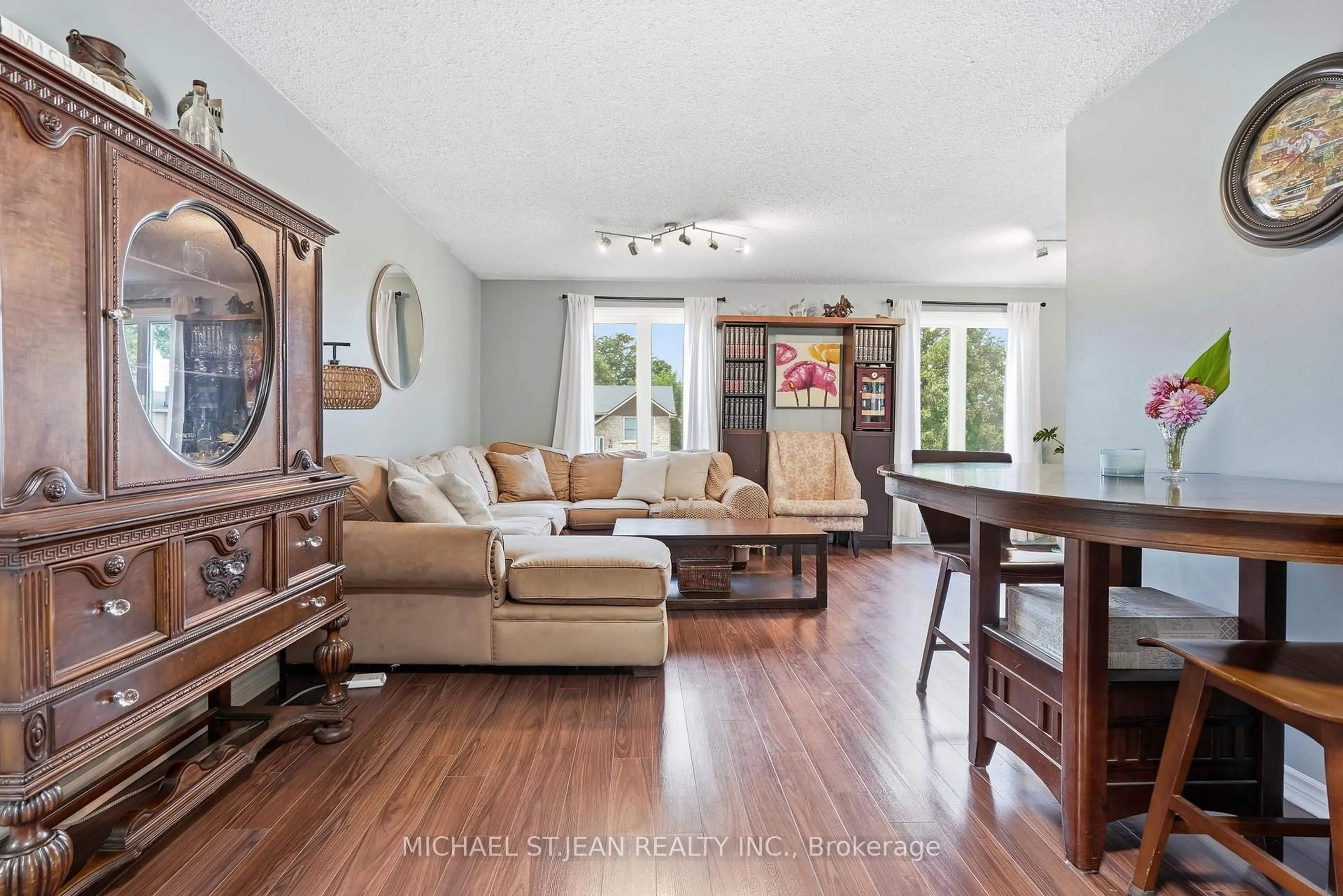 Living room with furniture, wood/laminate floor for 49 Markson Cres, Hamilton Ontario L8T 4W3