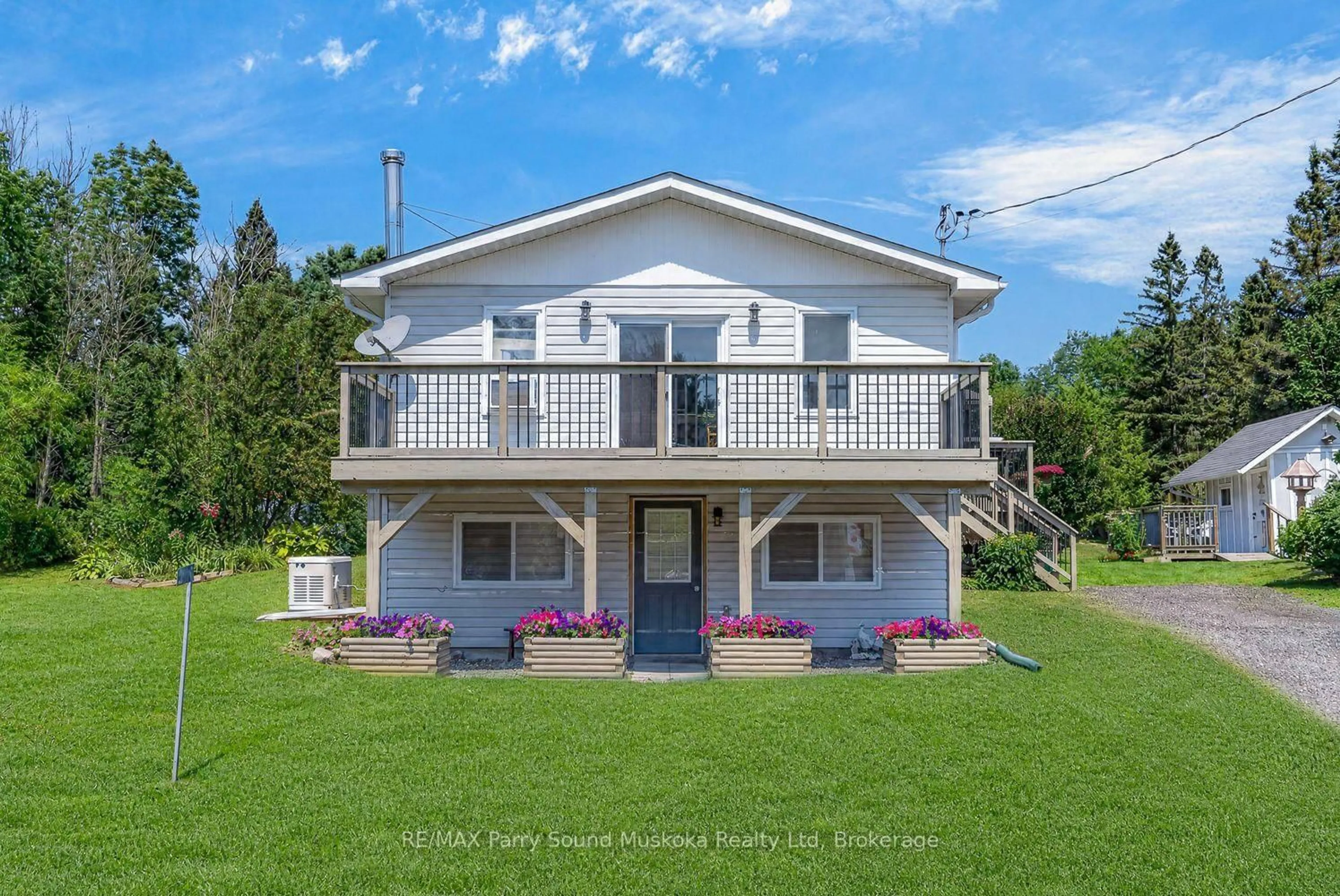A pic from outside/outdoor area/front of a property/back of a property/a pic from drone, water/lake/river/ocean view for 22 Ahmic St, Magnetawan Ontario P0A 1A0