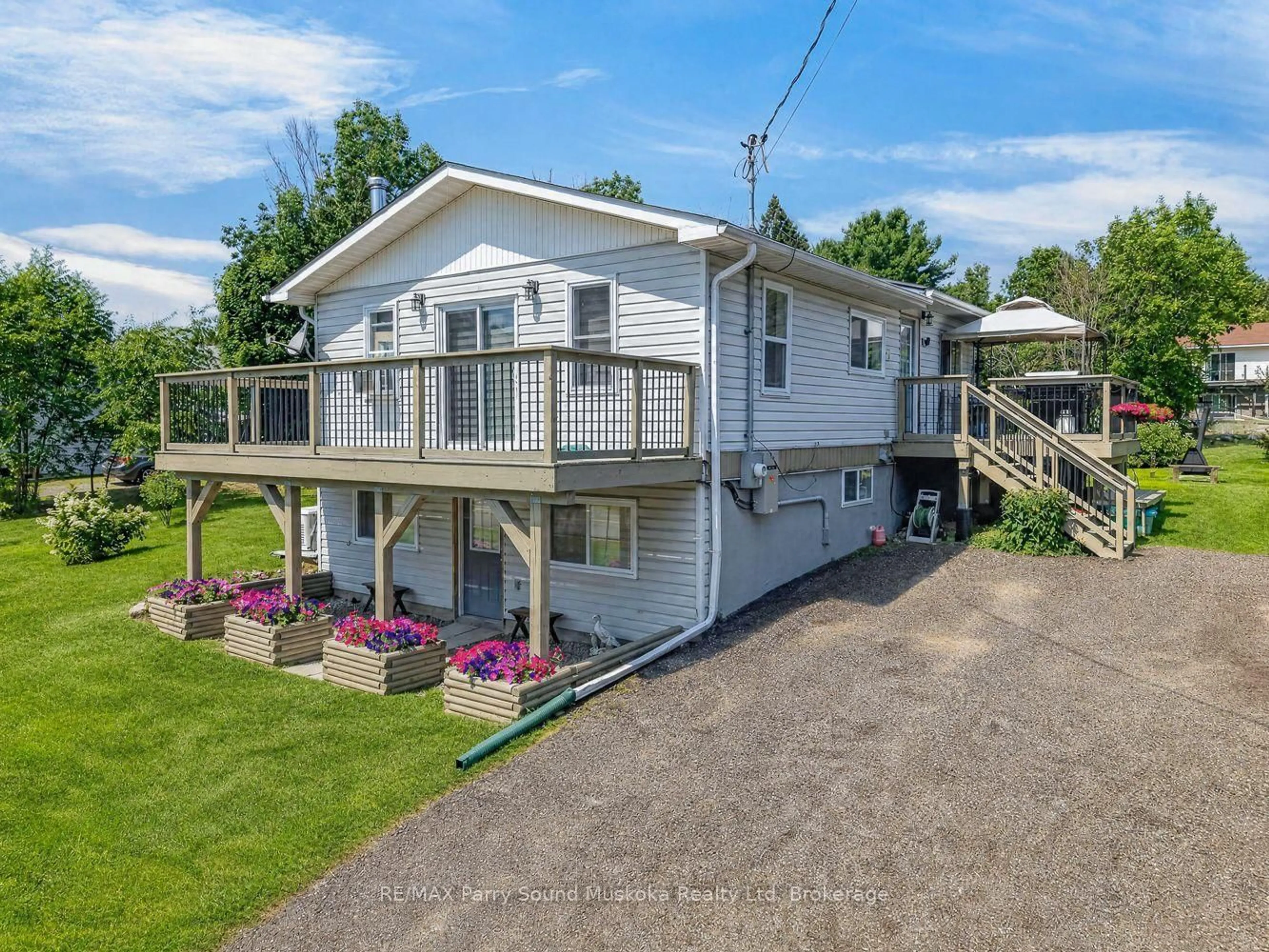 A pic from outside/outdoor area/front of a property/back of a property/a pic from drone, water/lake/river/ocean view for 22 Ahmic St, Magnetawan Ontario P0A 1A0