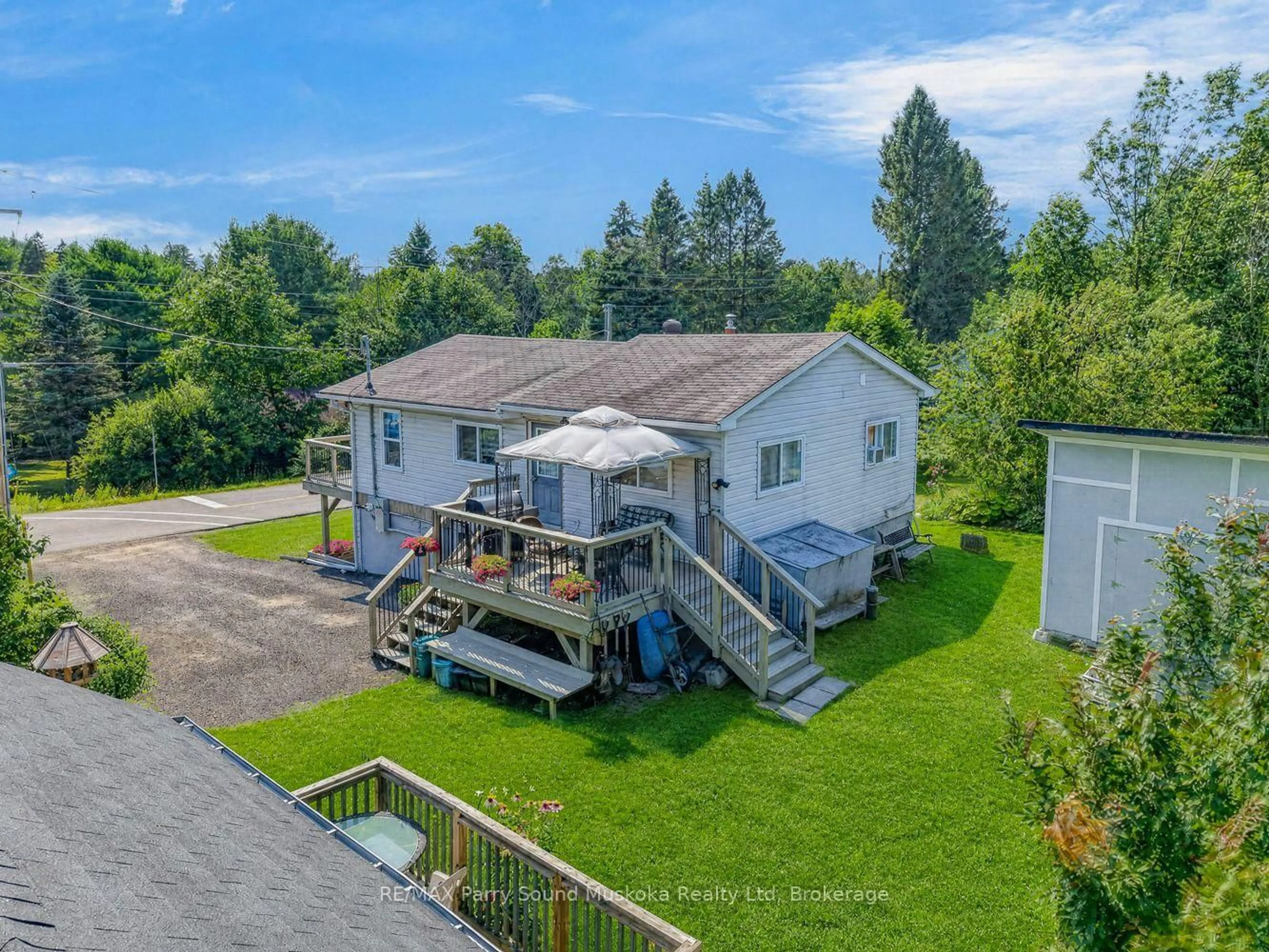 A pic from outside/outdoor area/front of a property/back of a property/a pic from drone, water/lake/river/ocean view for 22 Ahmic St, Magnetawan Ontario P0A 1A0