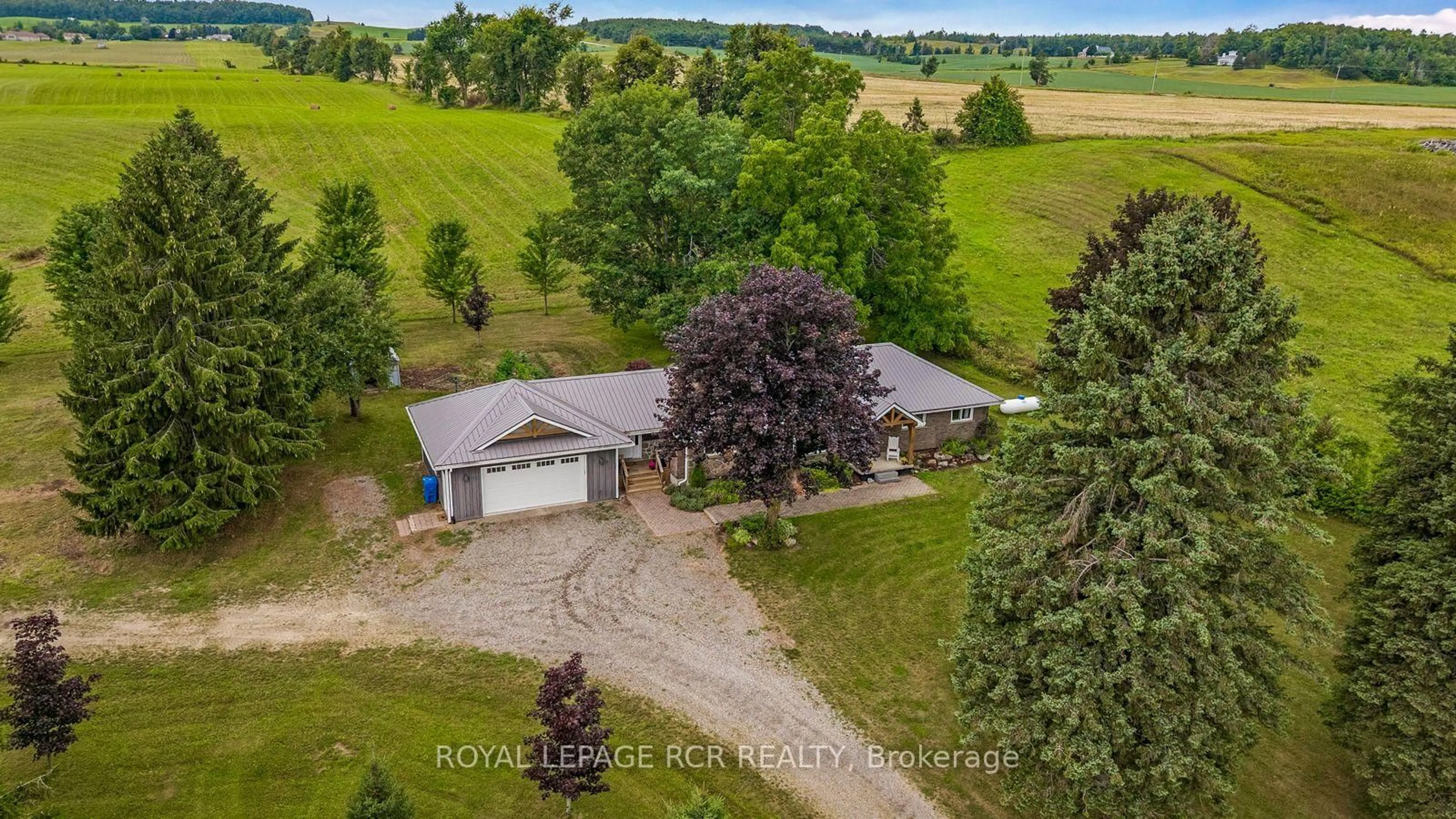 A pic from outside/outdoor area/front of a property/back of a property/a pic from drone, unknown for 716300 1st Line E, Mulmur Ontario L9V 0E9