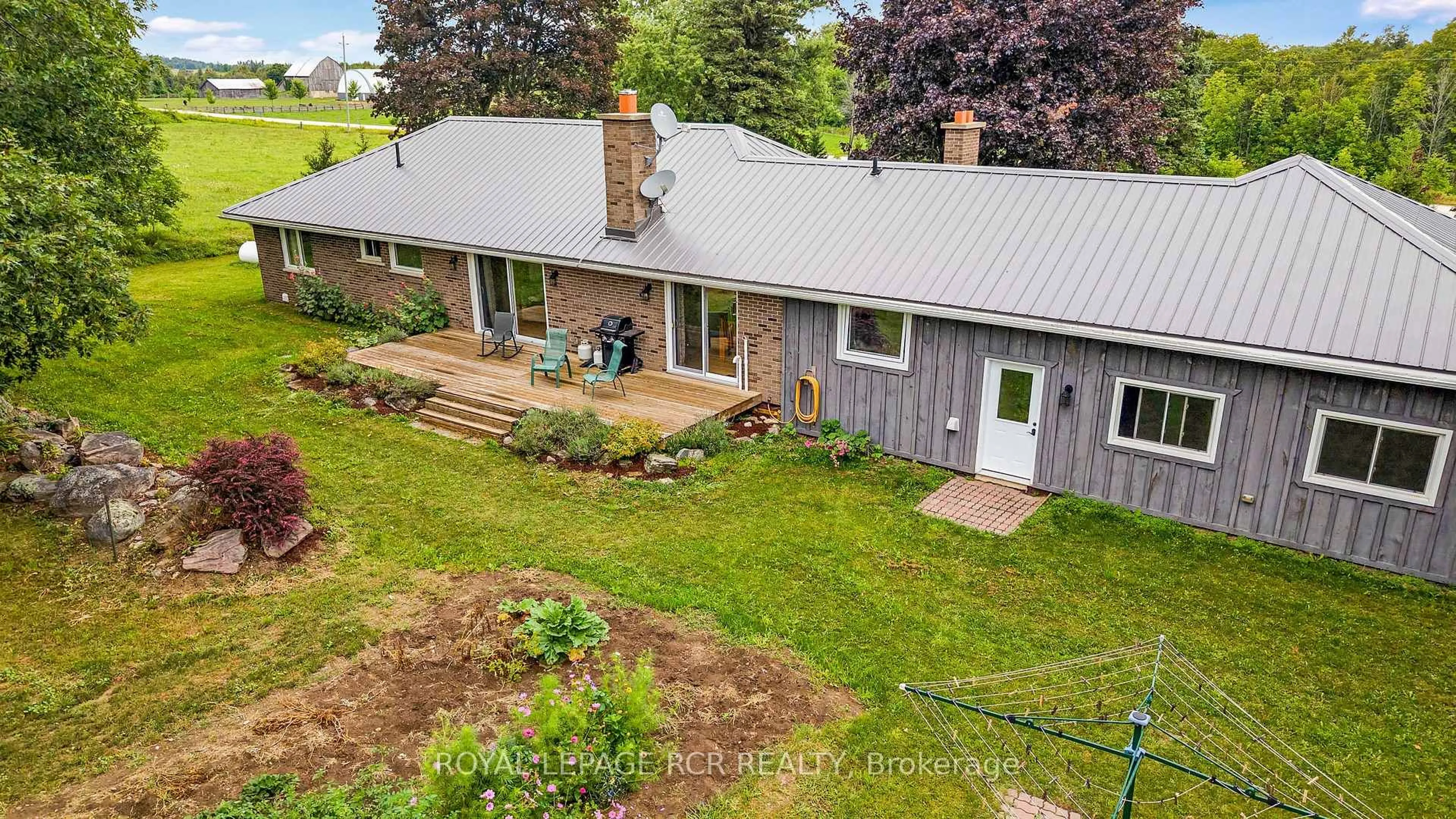 A pic from outside/outdoor area/front of a property/back of a property/a pic from drone, unknown for 716300 1st Line E, Mulmur Ontario L9V 0E9