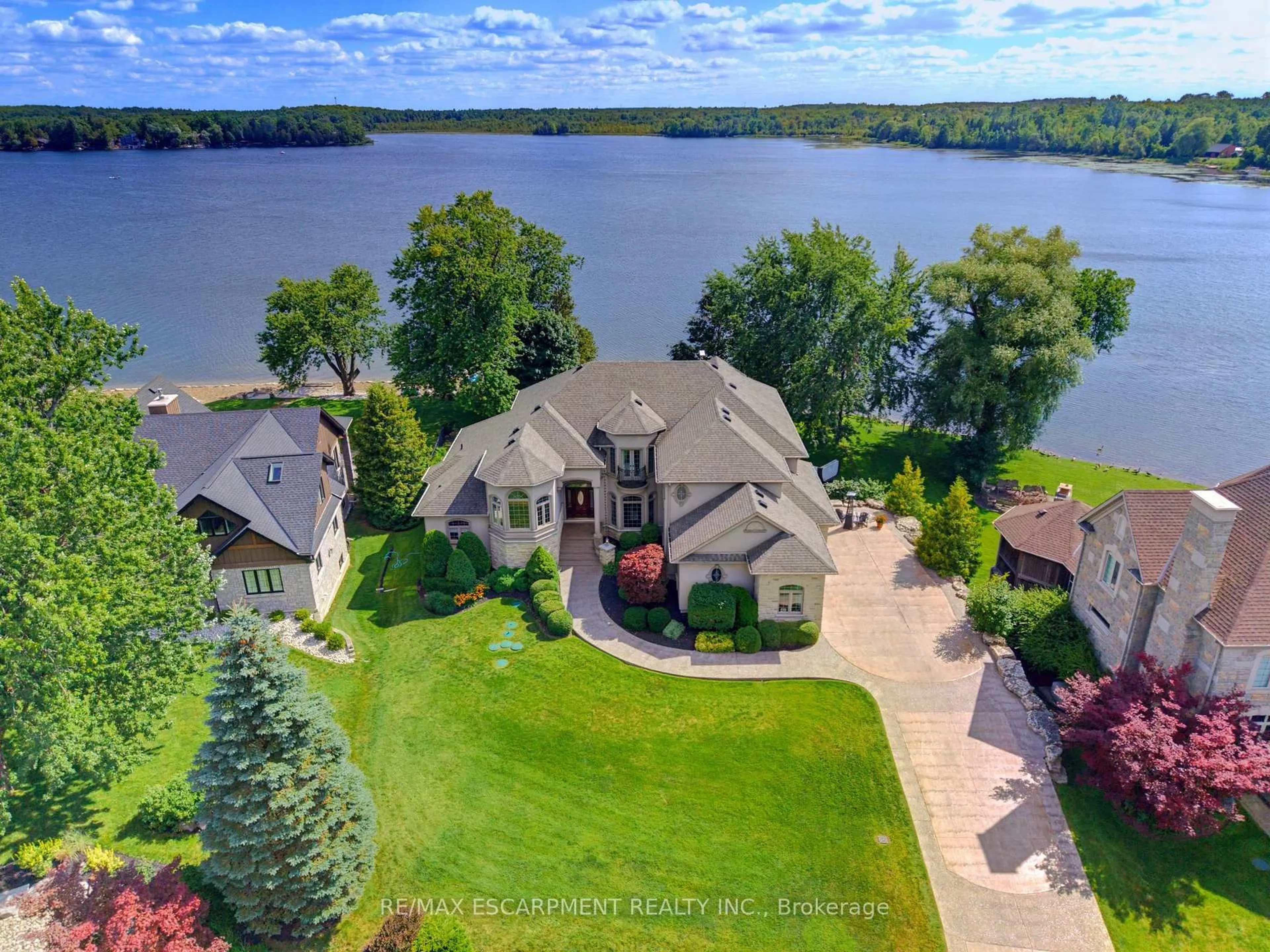 A pic from outside/outdoor area/front of a property/back of a property/a pic from drone, water/lake/river/ocean view for 46 Sandy Shore Blvd, Puslinch Ontario N3C 2V4