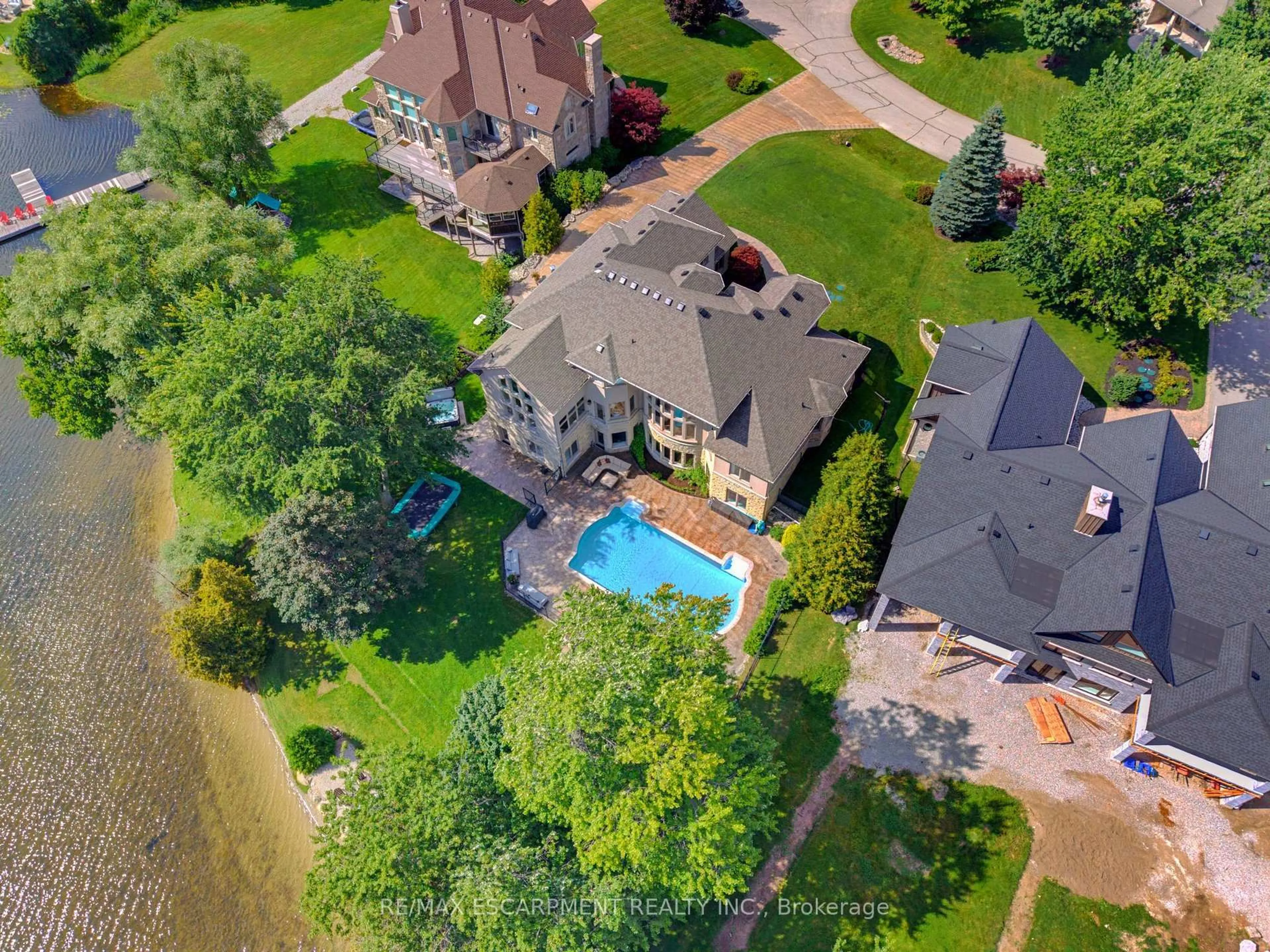 A pic from outside/outdoor area/front of a property/back of a property/a pic from drone, water/lake/river/ocean view for 46 Sandy Shore Blvd, Puslinch Ontario N3C 2V4