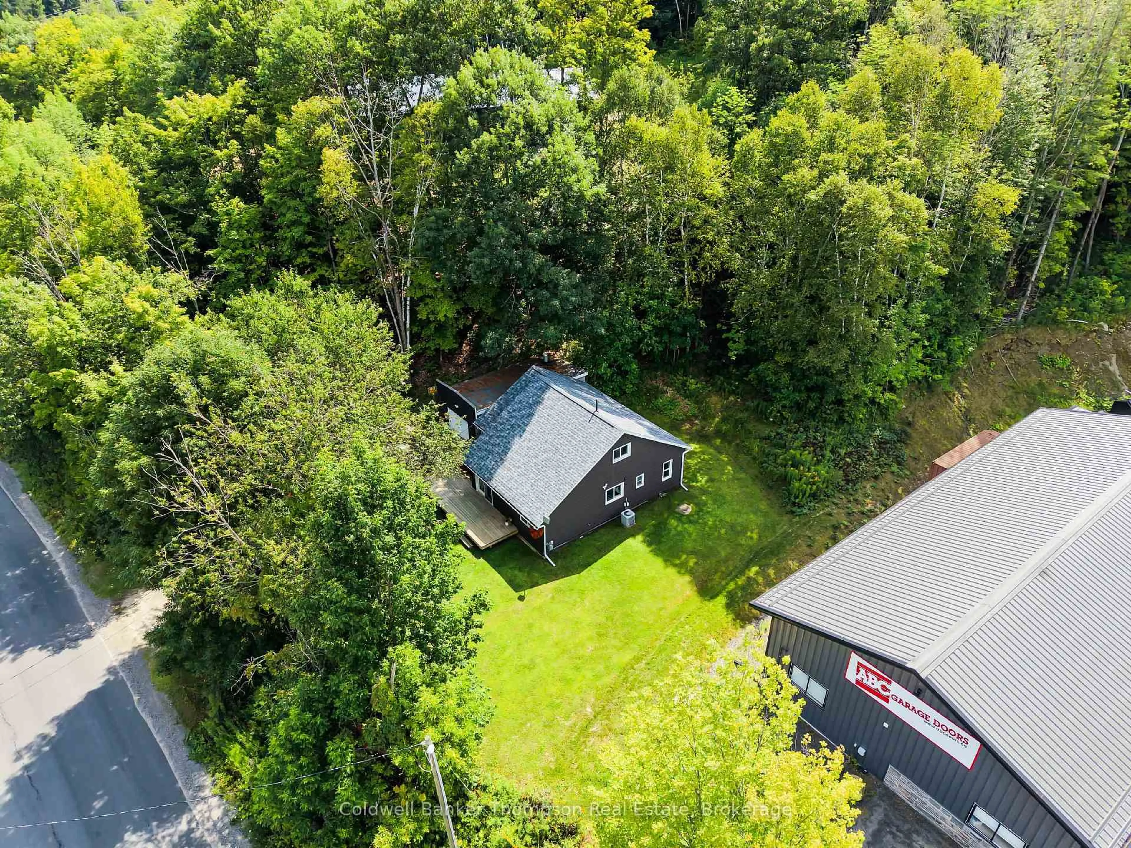 A pic from outside/outdoor area/front of a property/back of a property/a pic from drone, forest/trees view for 103 Lindgren Rd, Huntsville Ontario P1H 1Y2