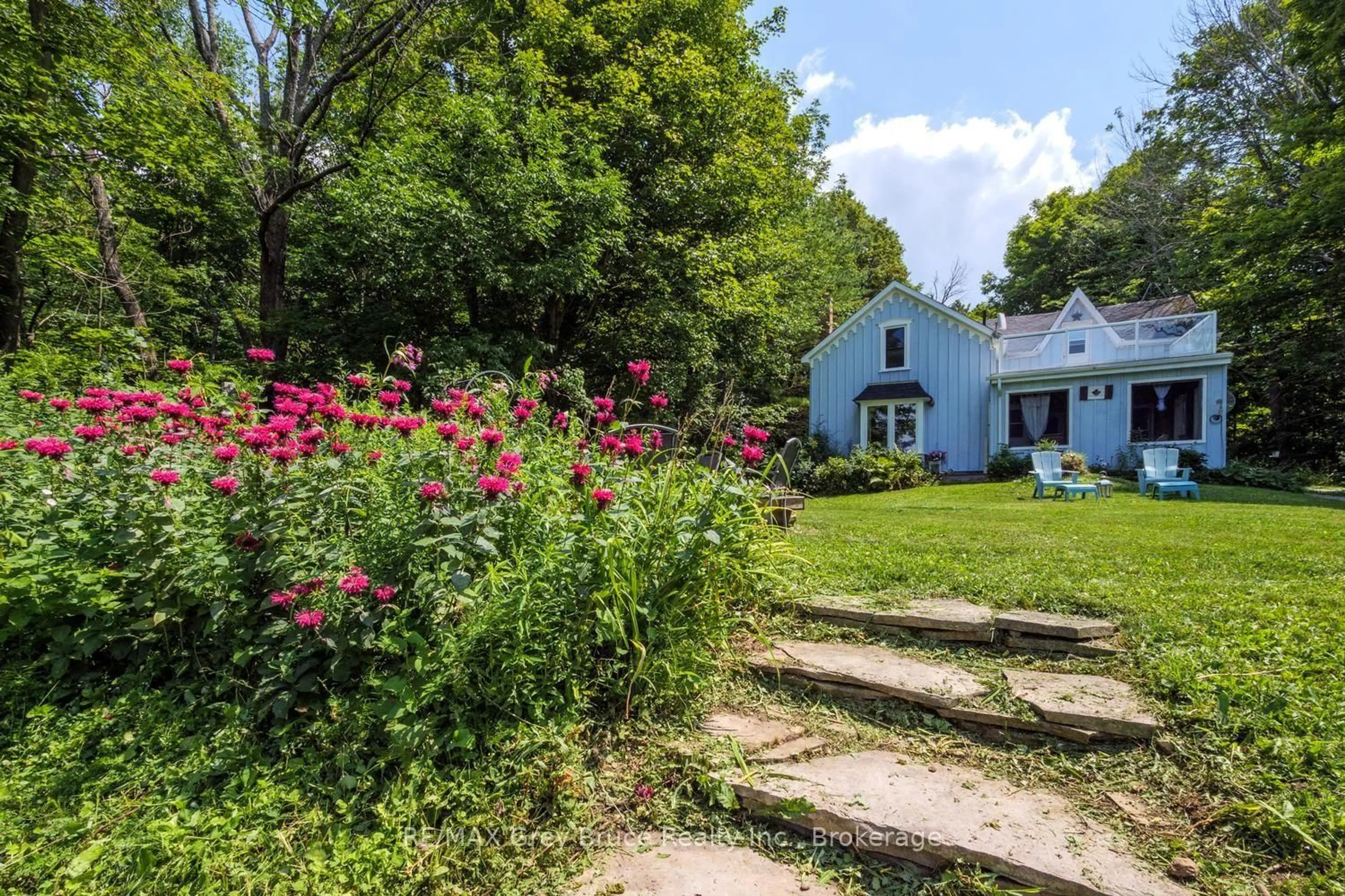 A pic from outside/outdoor area/front of a property/back of a property/a pic from drone, street for 501306 Grey 1 Rd, Georgian Bluffs Ontario N0H 2T0