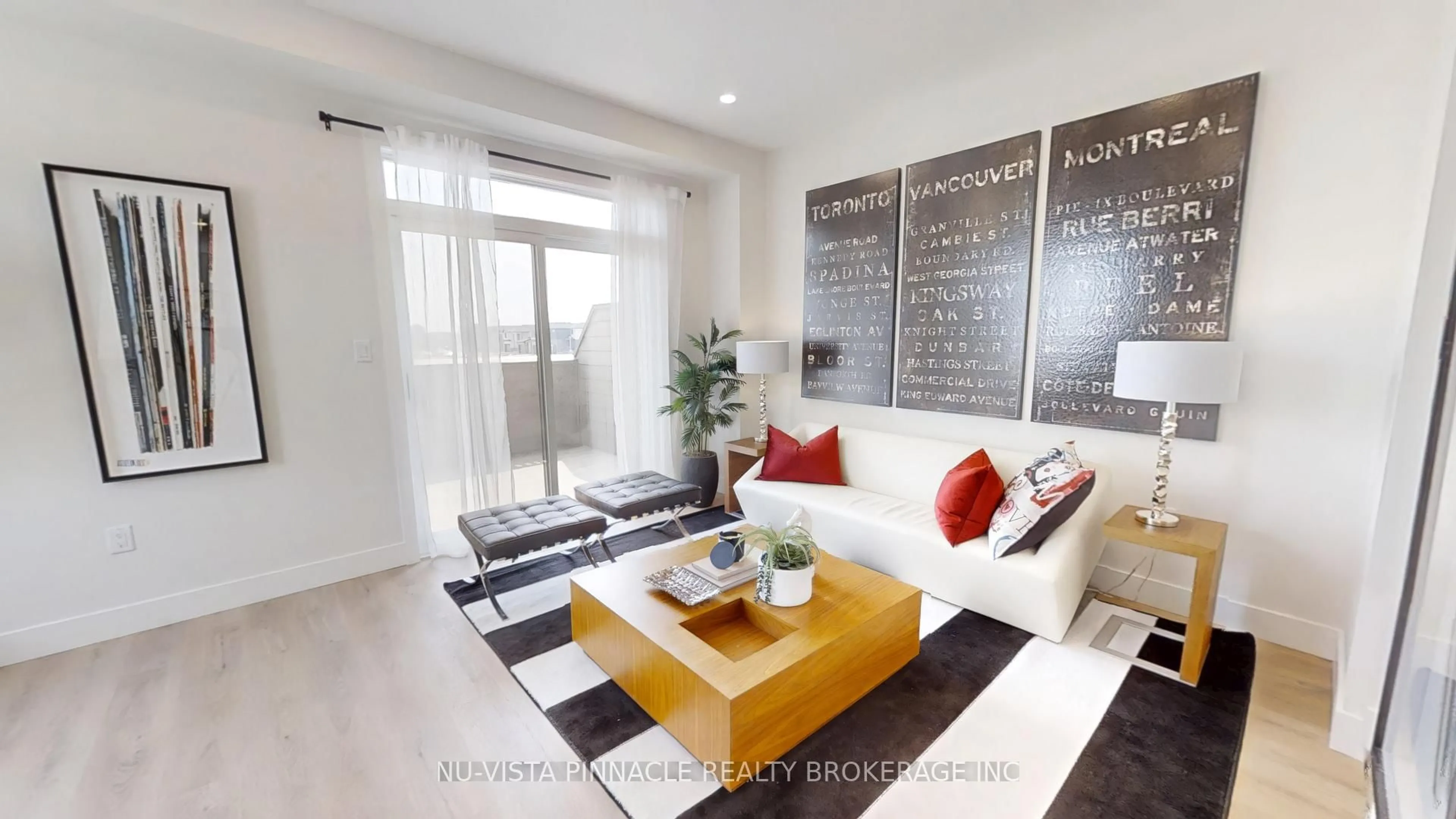 Living room with furniture, wood/laminate floor for 1882 Evans Blvd, London South Ontario N6M 0N5