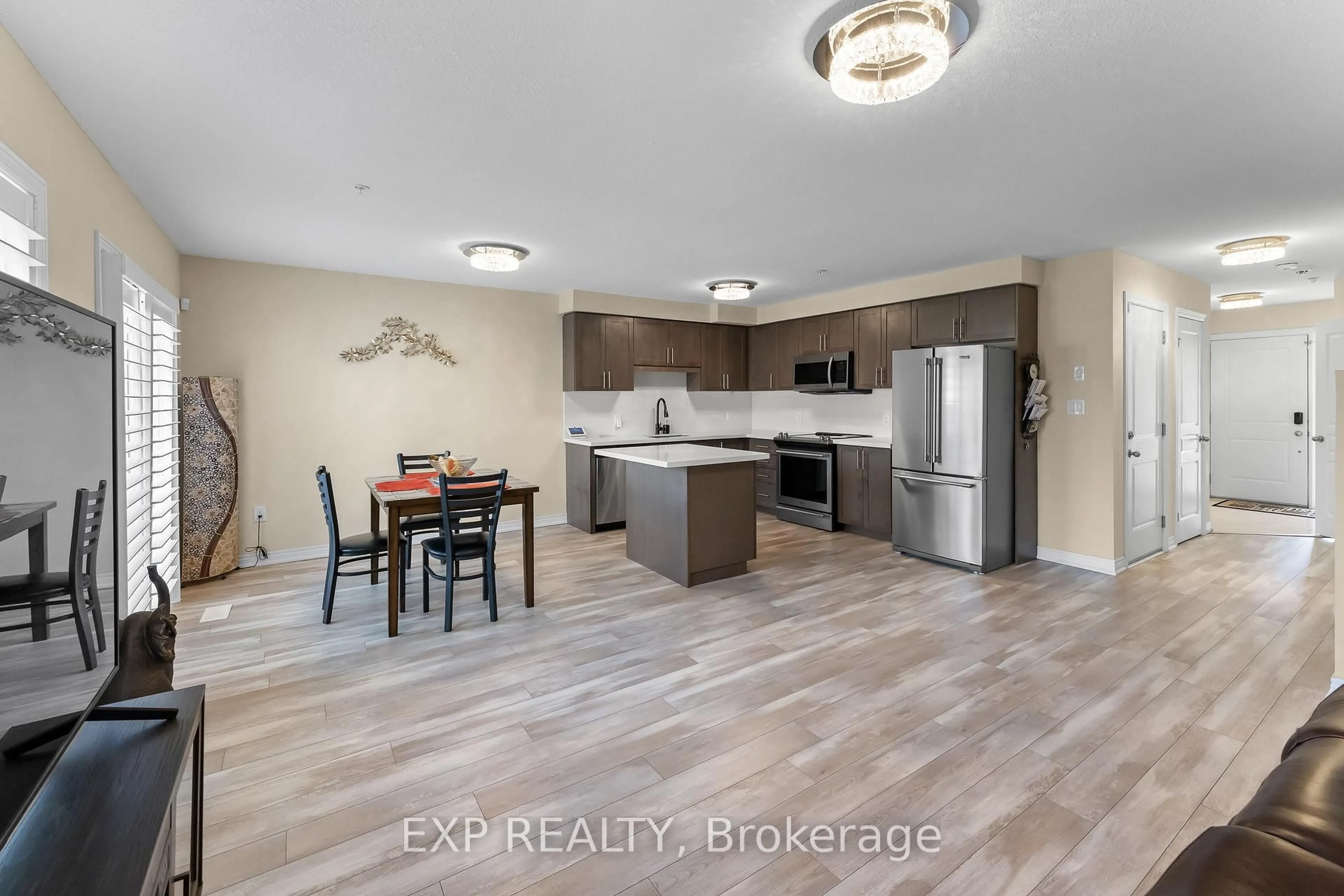Open concept kitchen, wood/laminate floor for 60 Canterbury Dr #3, St. Catharines Ontario L2P 3M8