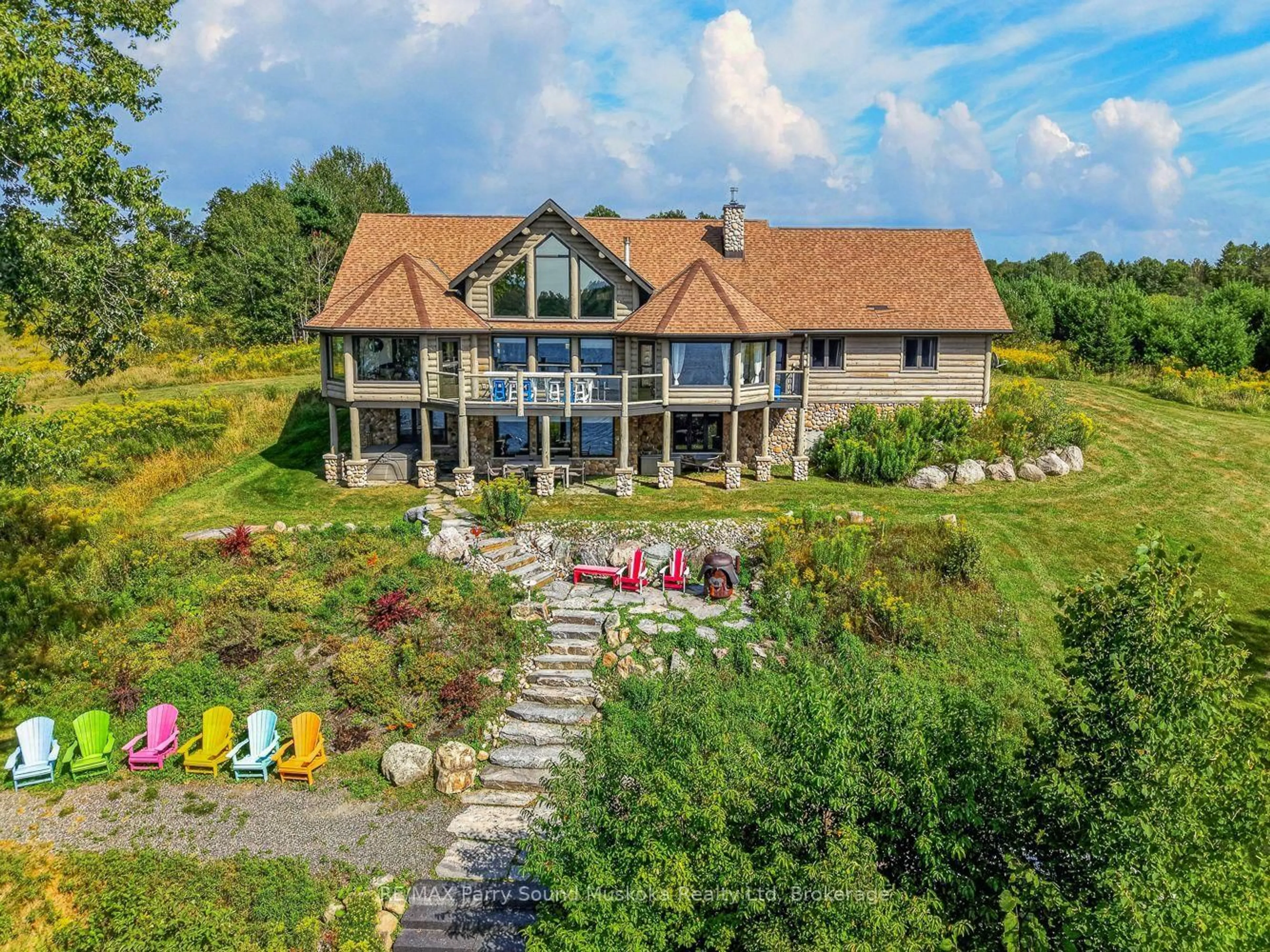 A pic from outside/outdoor area/front of a property/back of a property/a pic from drone, unknown for 64 Mccords Rd, McKellar Ontario P2A 0B5