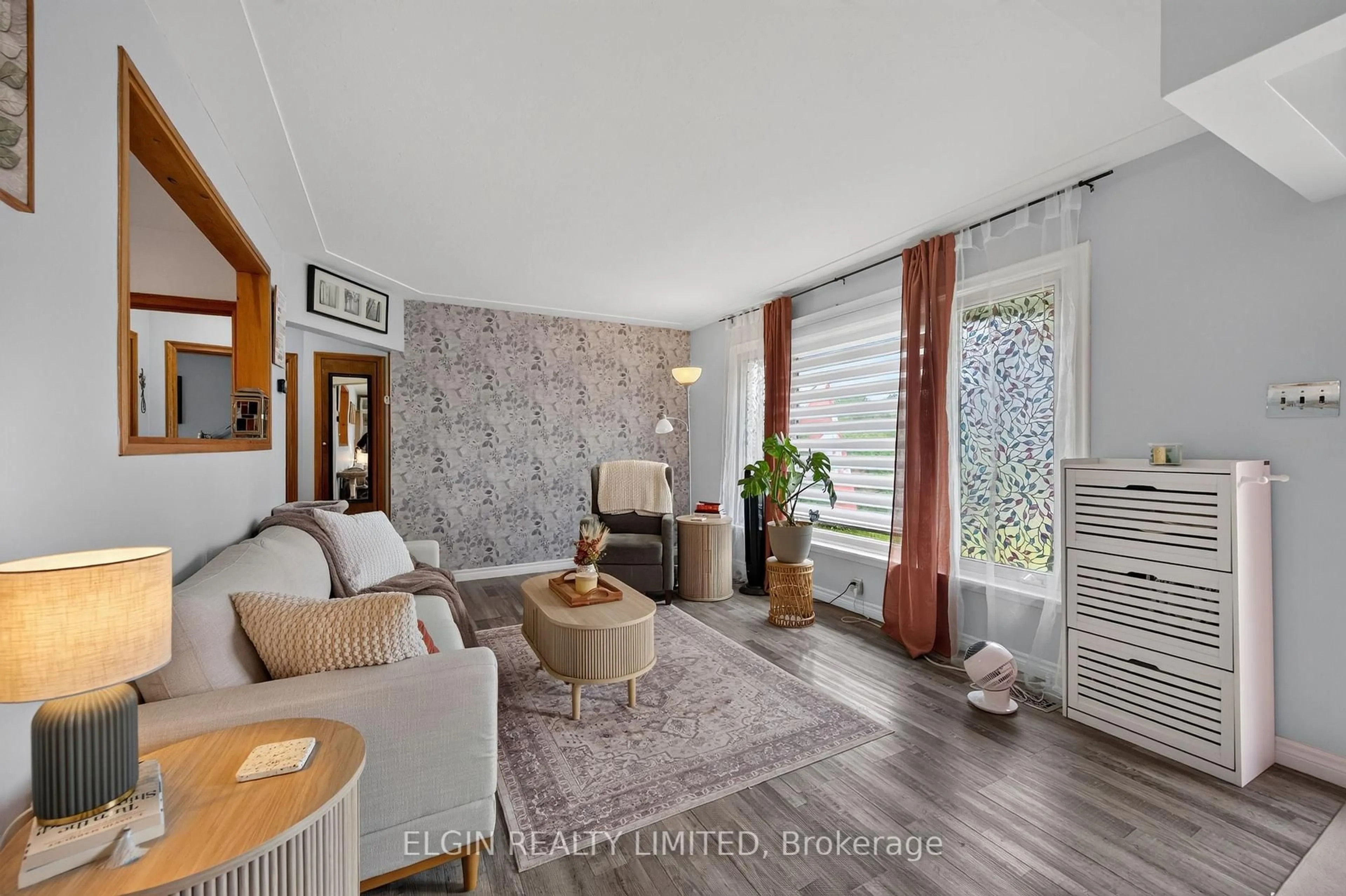Living room with furniture, wood/laminate floor for 32 Coyne St, St. Thomas Ontario N5R 4X8
