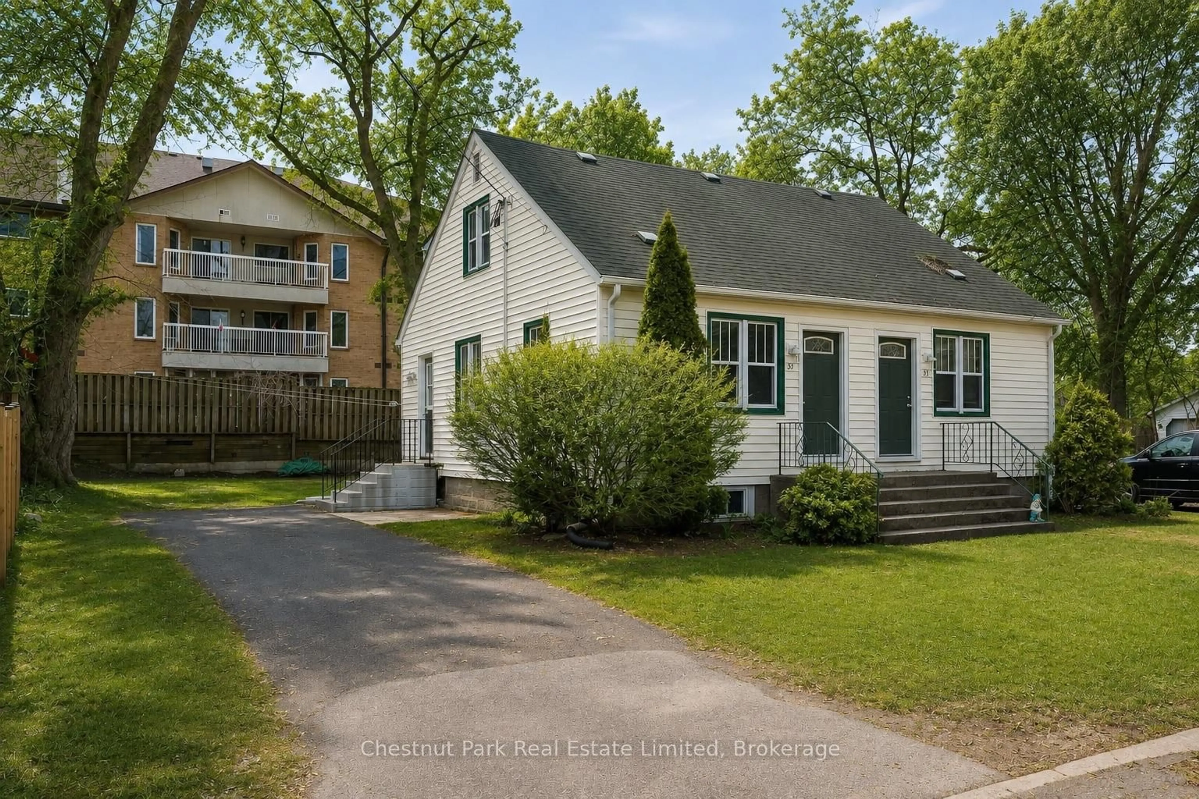 Home with vinyl exterior material, street for 31-33 Washburn St, Prince Edward County Ontario K0K 2T0