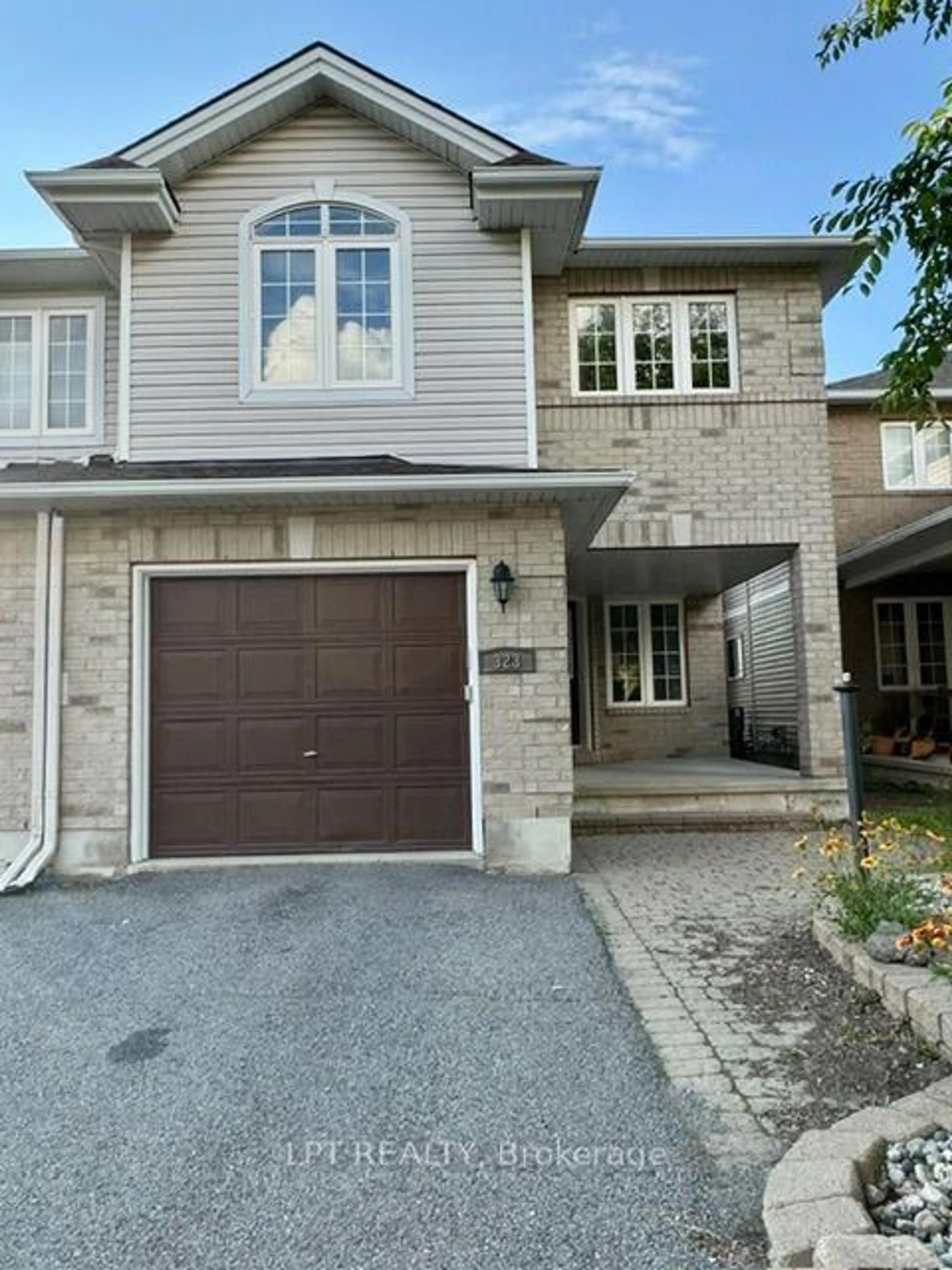 Home with brick exterior material, street for 323 Berrigan Dr, Ottawa Ontario K2J 5E2