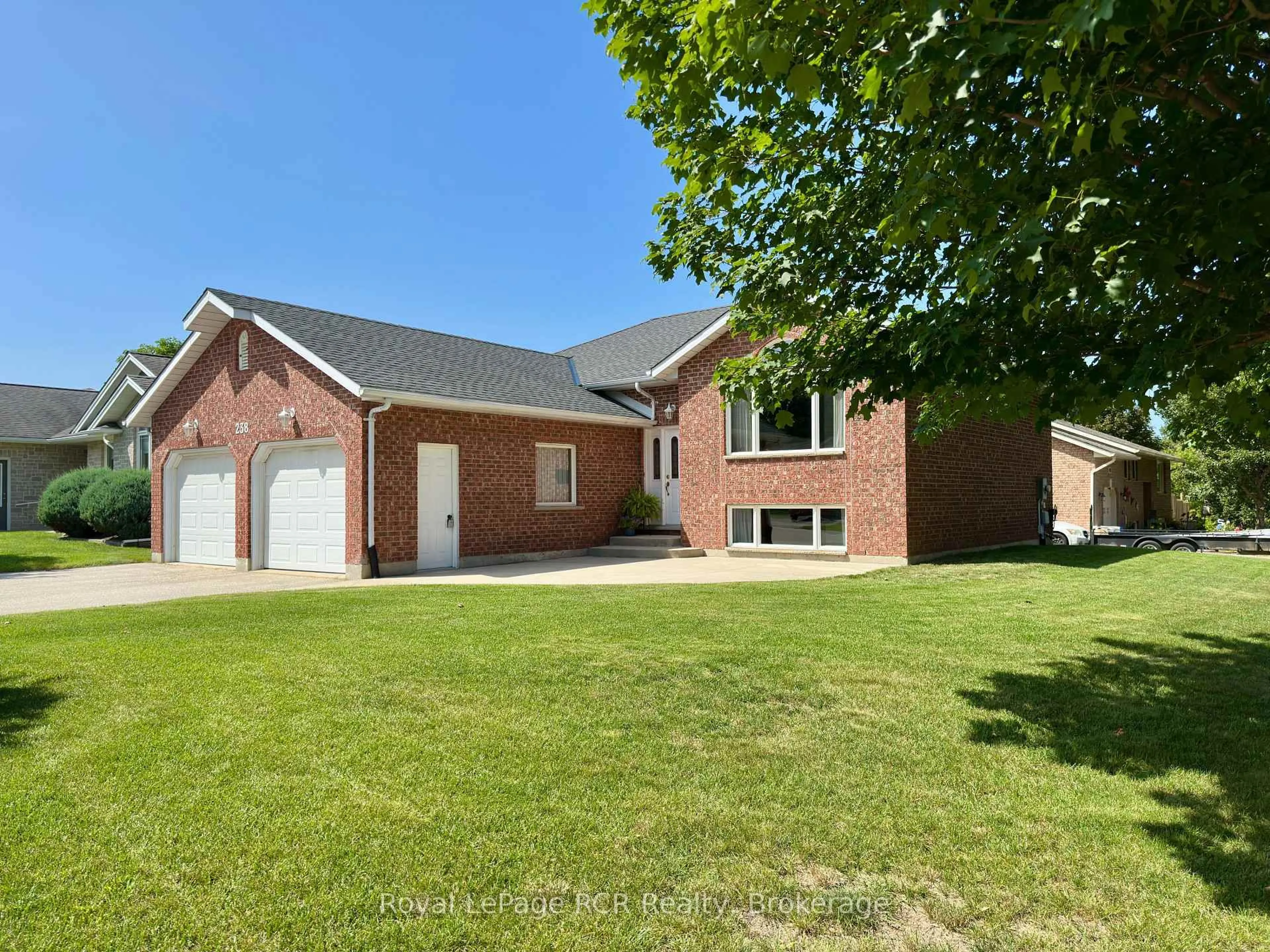 Home with brick exterior material, street for 238 4th Street Cres, Hanover Ontario N4N 3S2
