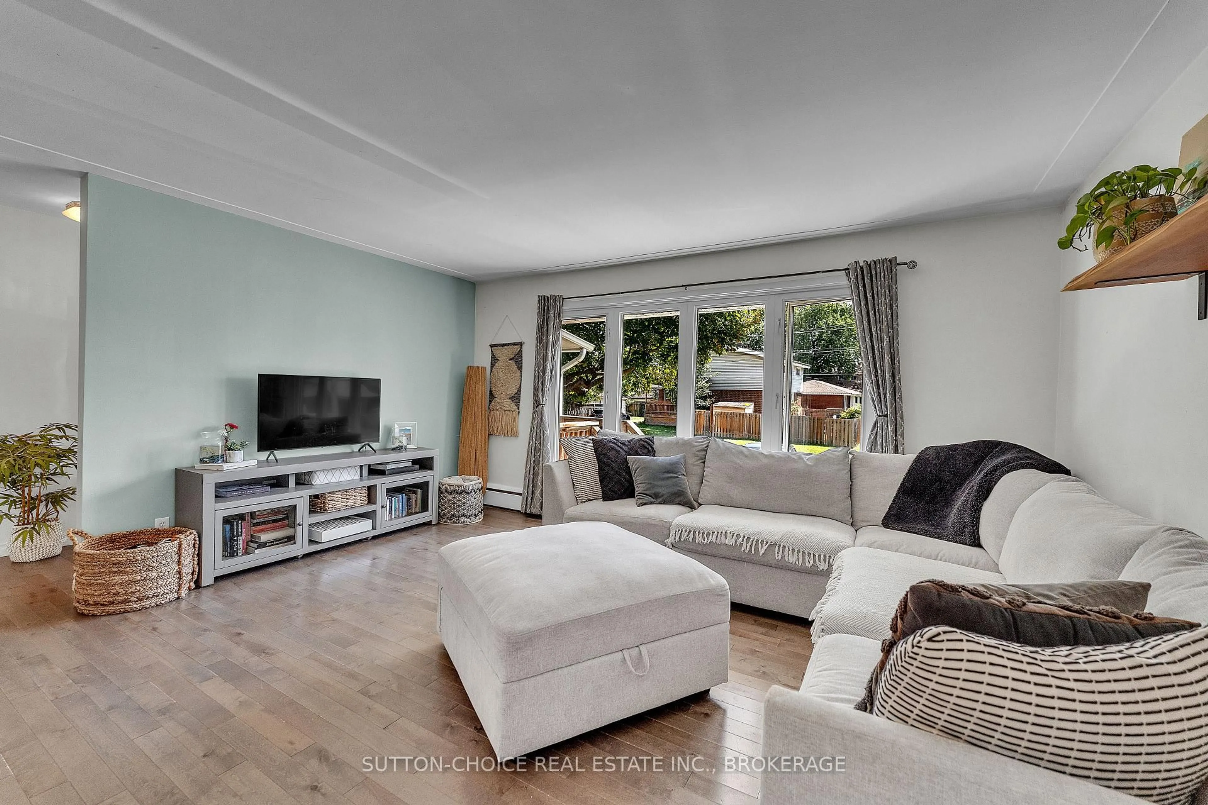Living room with furniture, wood/laminate floor for 11 Milford Cres, North Bay Ontario P1A 1M4