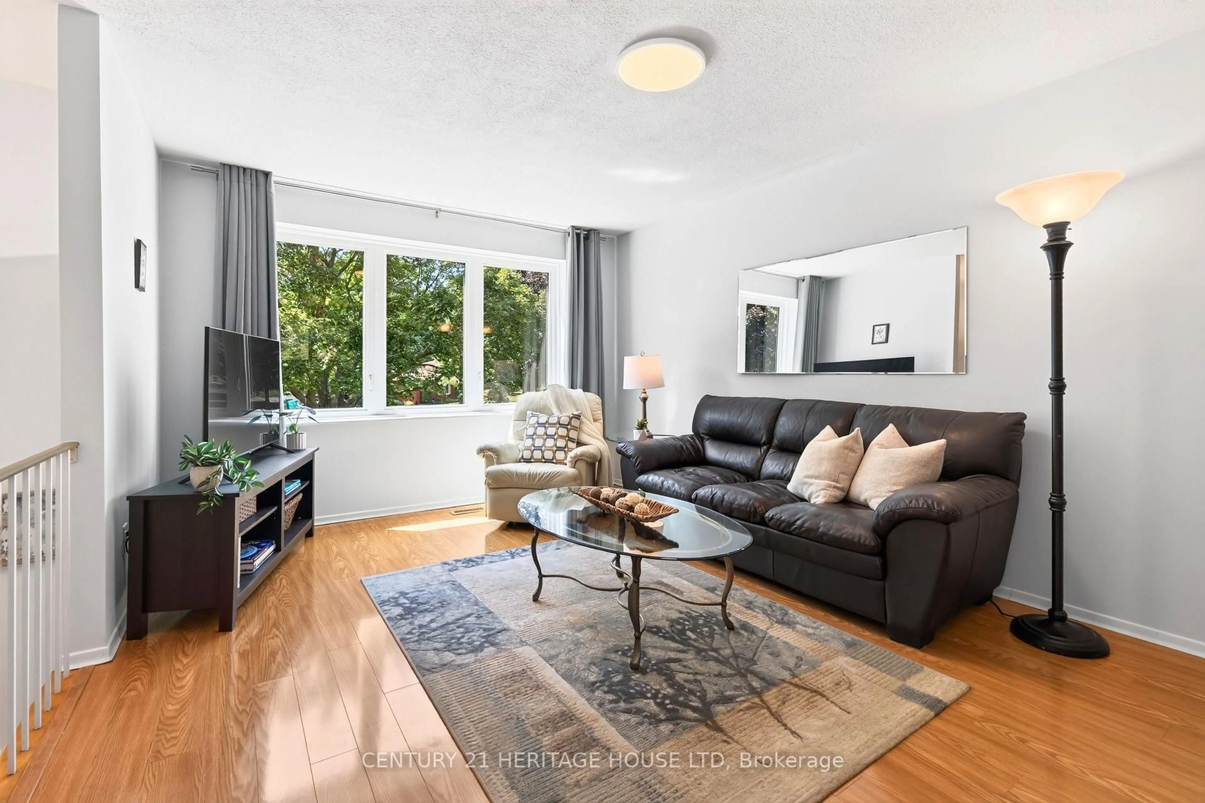 Living room with furniture, wood/laminate floor for 74 Cherry Hill Dr, Kitchener Ontario N2E 1N6