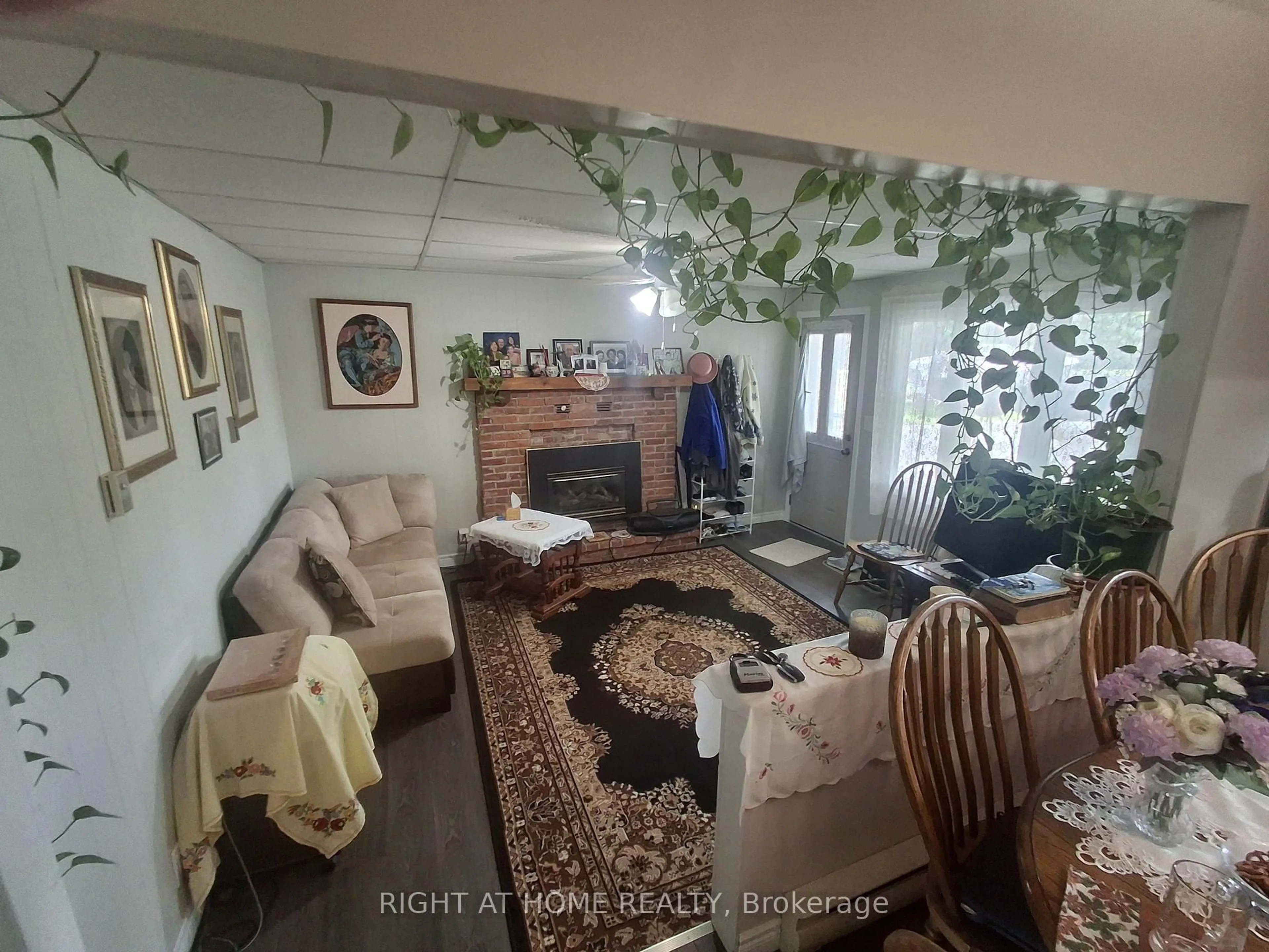 Living room with furniture, floor is not visible for 717 Mersea Rd 6 Rd, Leamington Ontario N8H 3V8