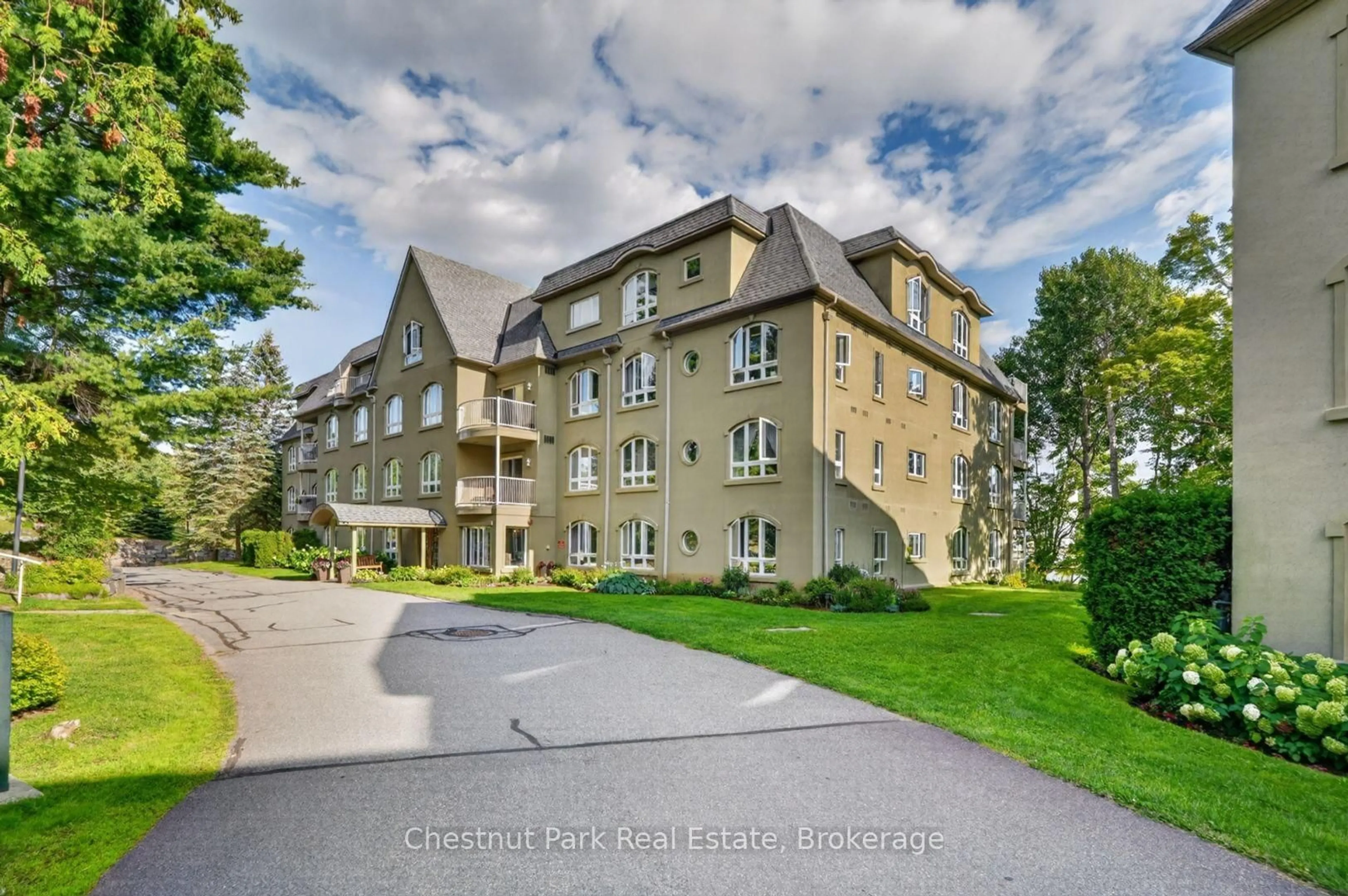 A pic from outside/outdoor area/front of a property/back of a property/a pic from drone, building for 31 DAIRY Lane #307, Huntsville Ontario P1H 2L7