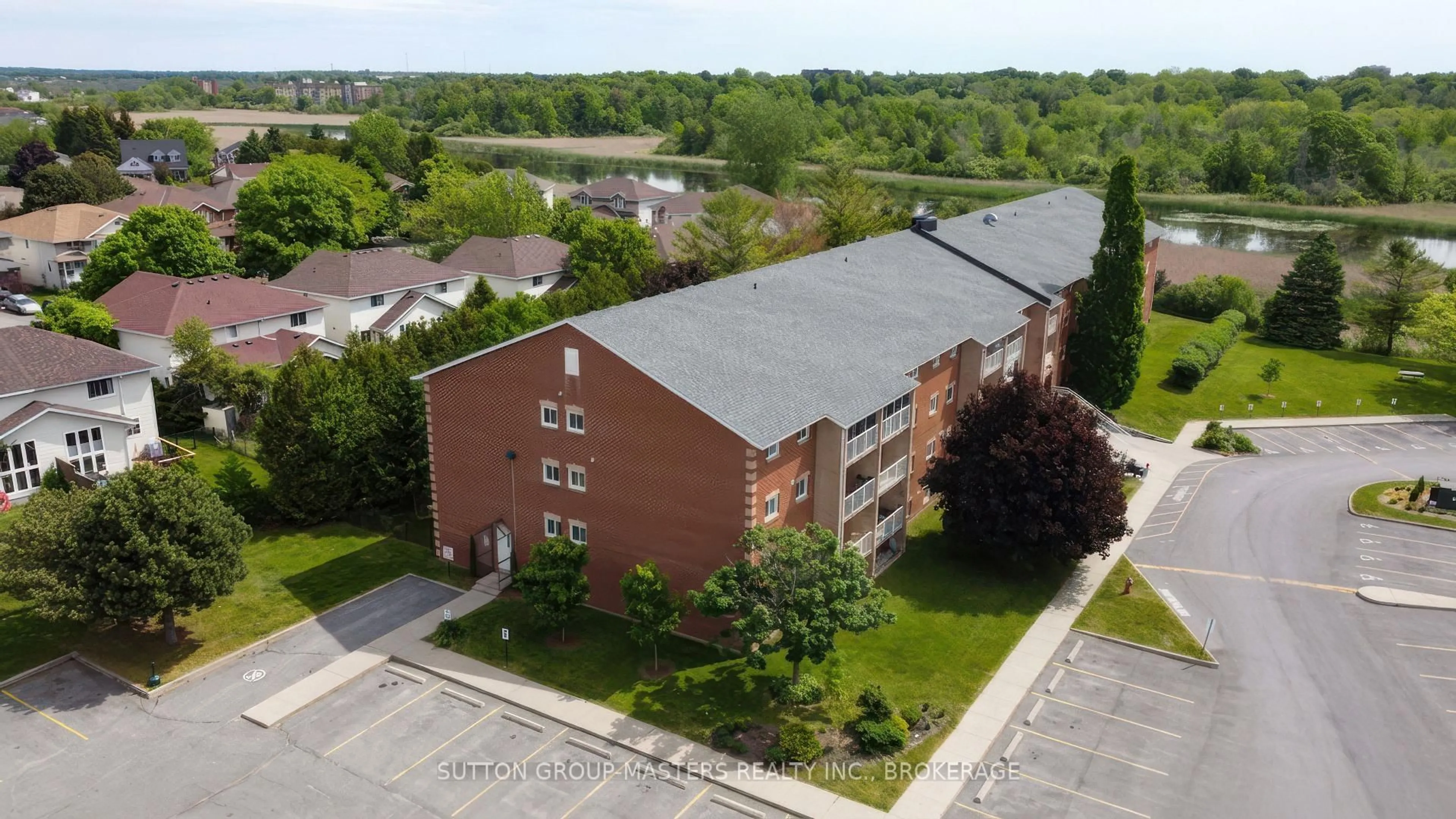 A pic from outside/outdoor area/front of a property/back of a property/a pic from drone, building for 580 Armstrong Rd #114, Kingston Ontario K7M 8M3