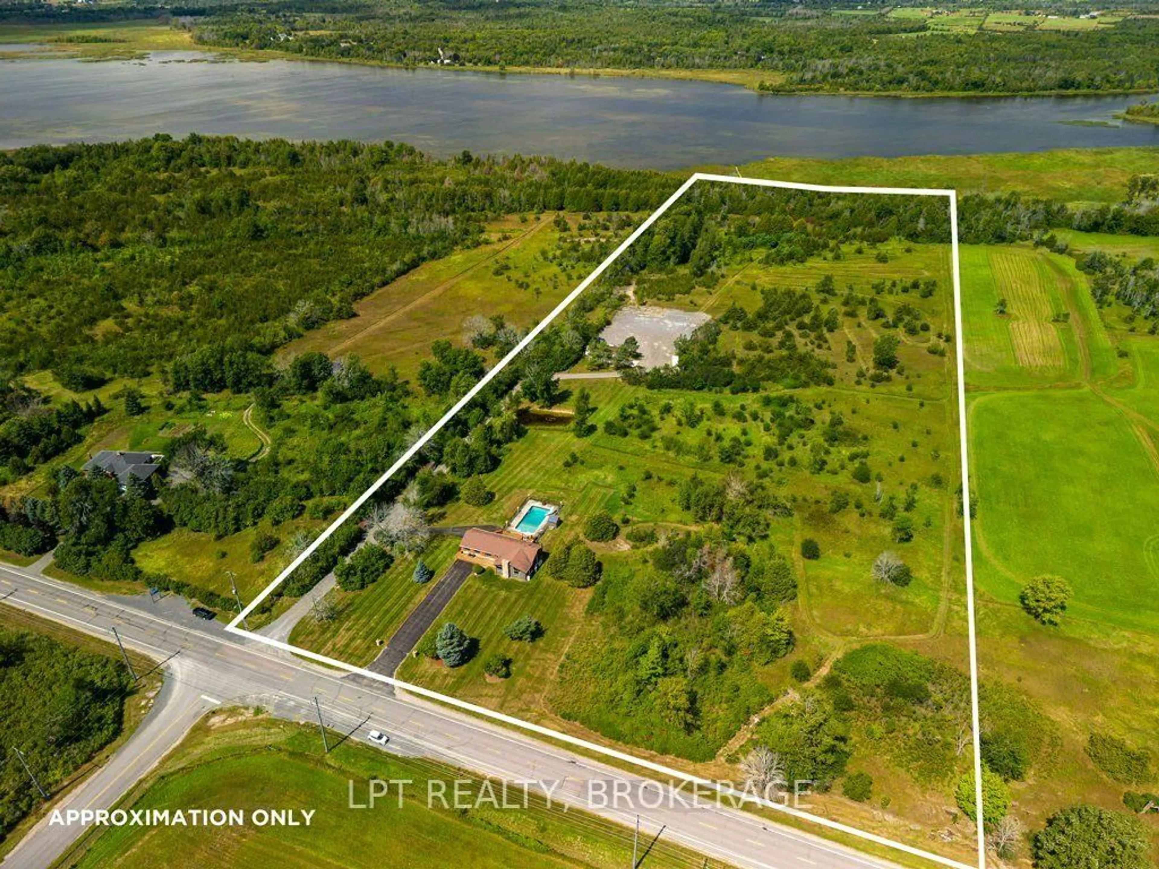 A pic from outside/outdoor area/front of a property/back of a property/a pic from drone, water/lake/river/ocean view for 4404 Unity Rd, Bissett Creek Ontario K0H 2H0