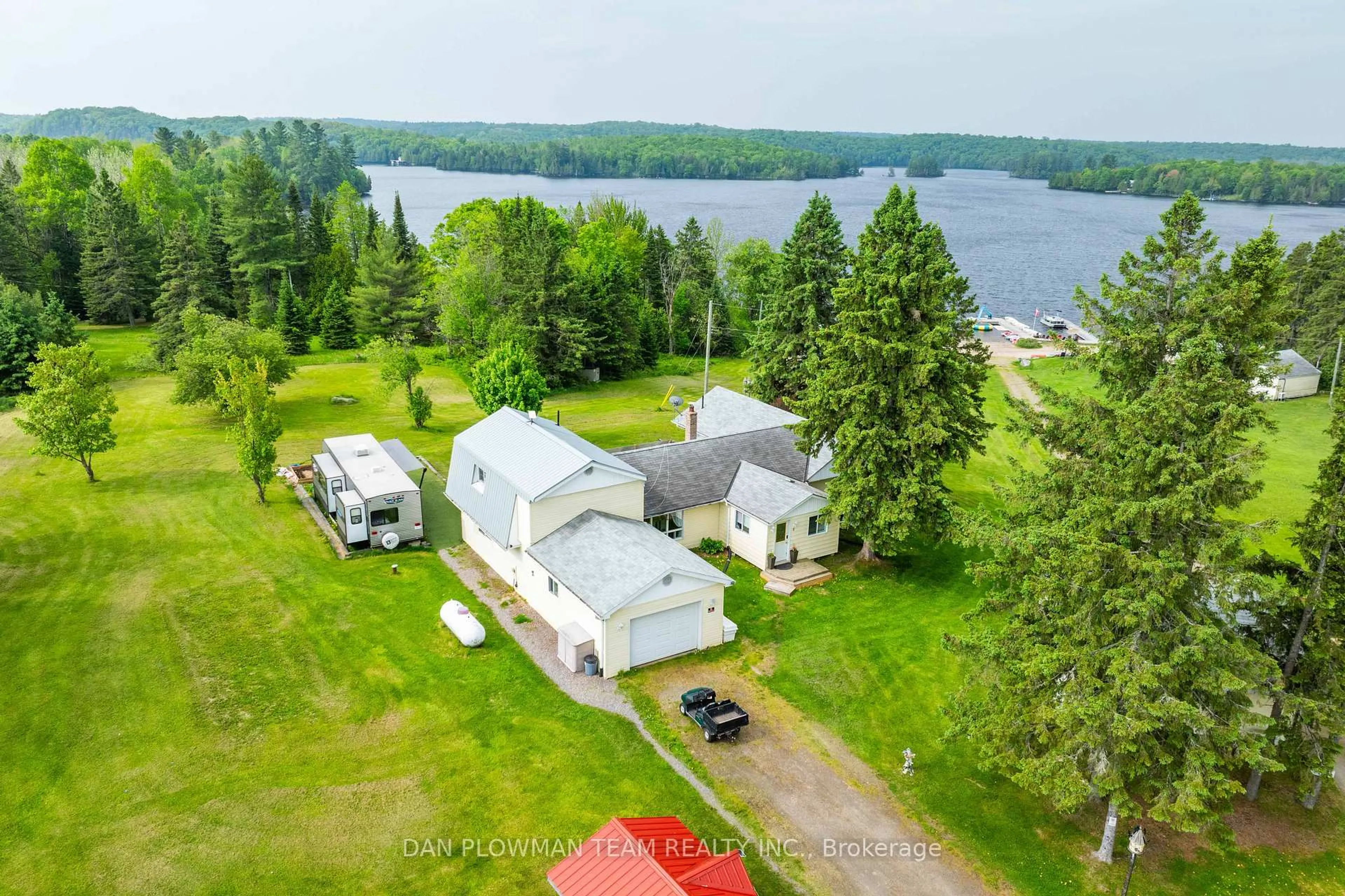 A pic from outside/outdoor area/front of a property/back of a property/a pic from drone, water/lake/river/ocean view for 184 Chapman Dr, Magnetawan Ontario P0A 1C0