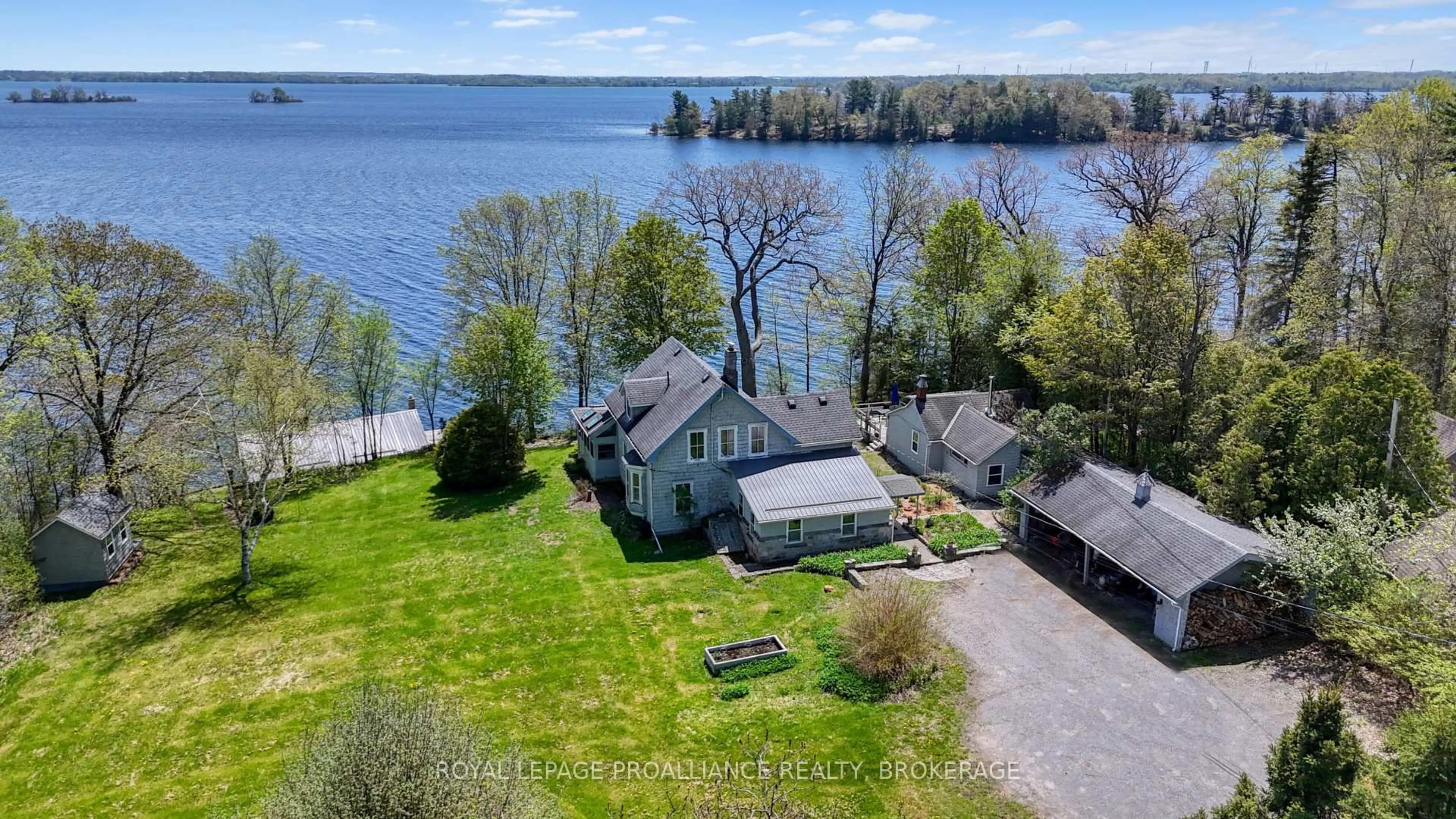 A pic from outside/outdoor area/front of a property/back of a property/a pic from drone, water/lake/river/ocean view for 1295 Highway 2, Kingston Ontario K7L 4V1