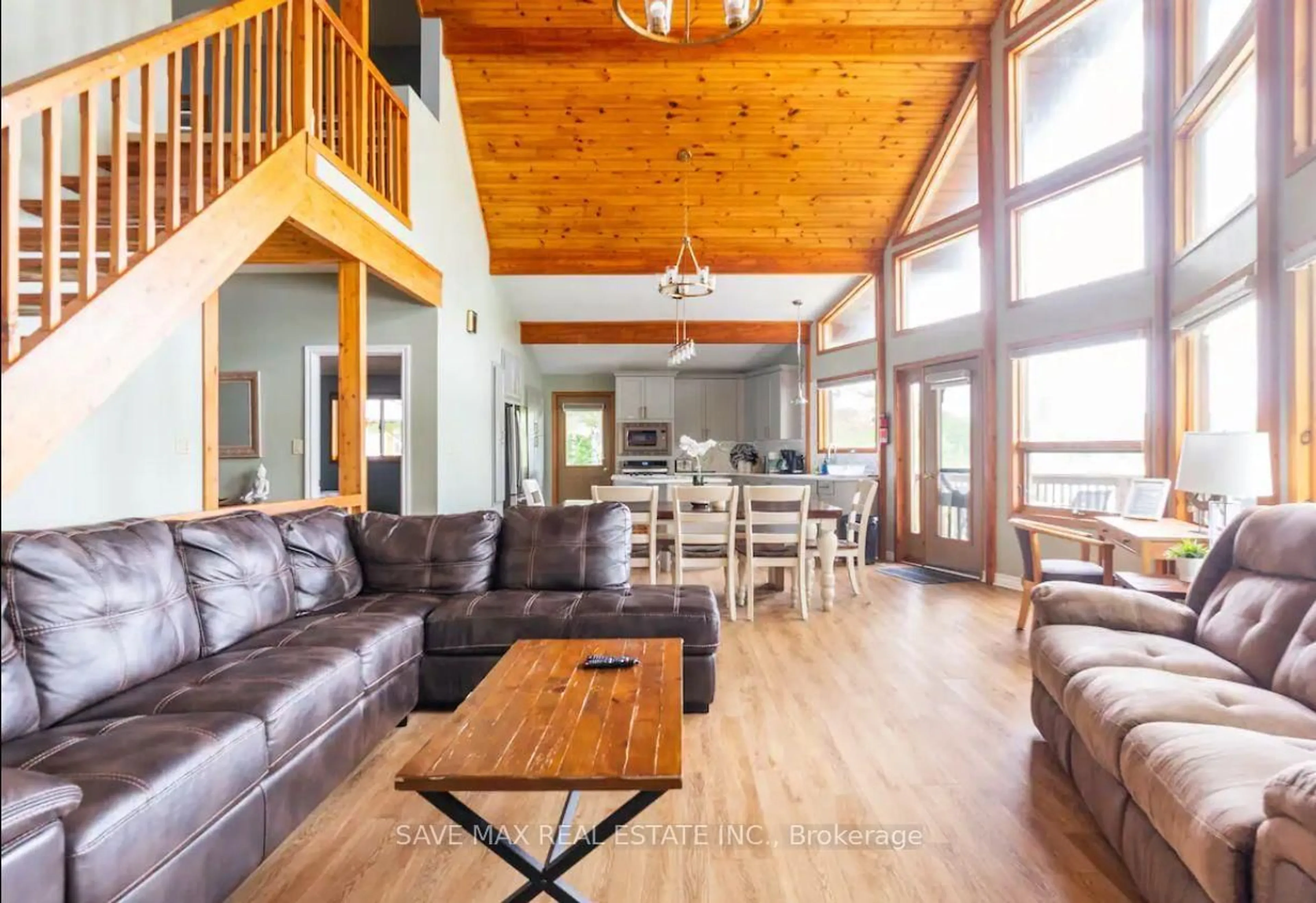Living room with furniture, wood/laminate floor for 42 Todholm Driv Todholm Dr, Muskoka Lakes Ontario P0B 1J0