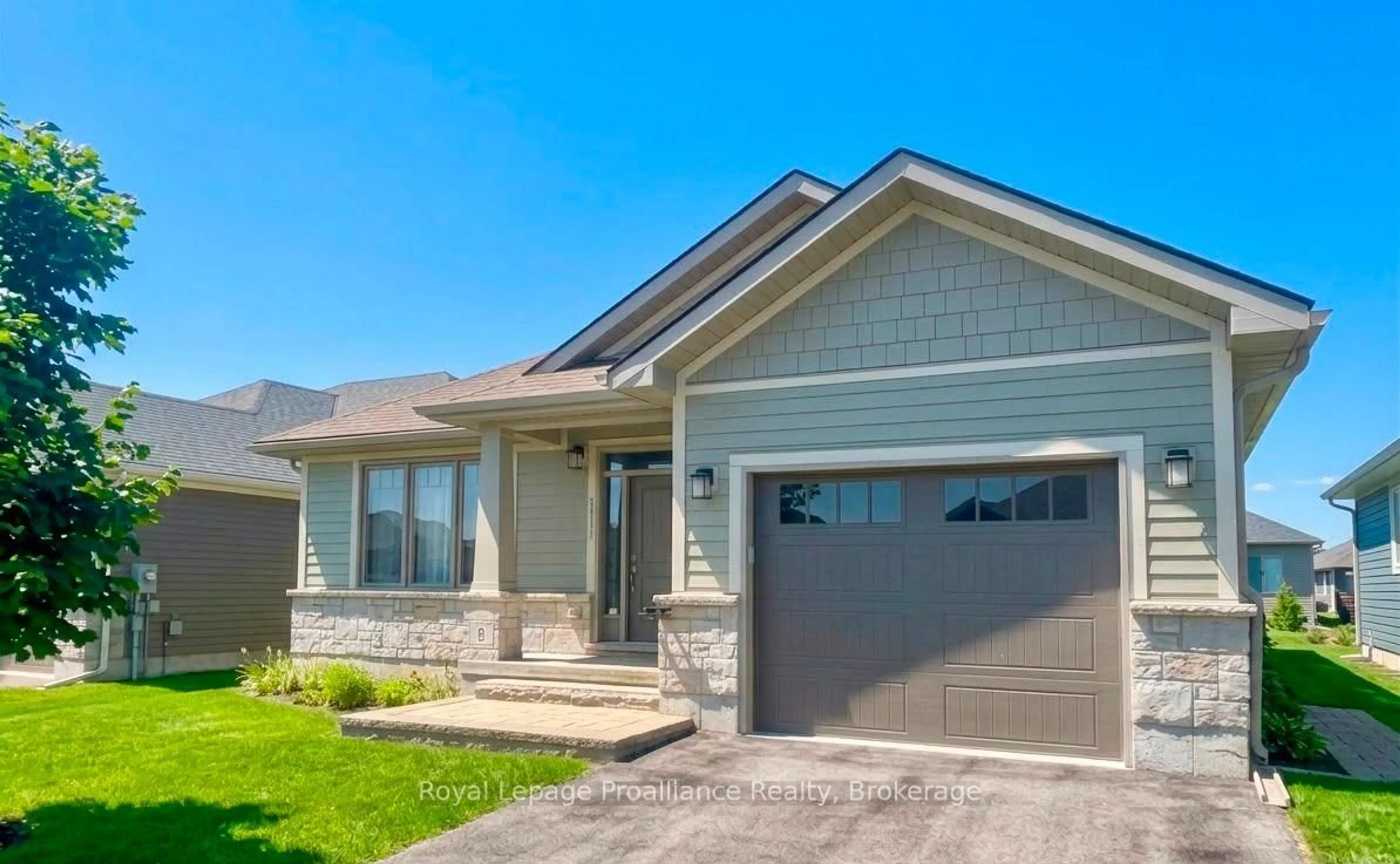 Home with vinyl exterior material, street for 8 Tessa Blvd, Belleville Ontario K8N 4Z5