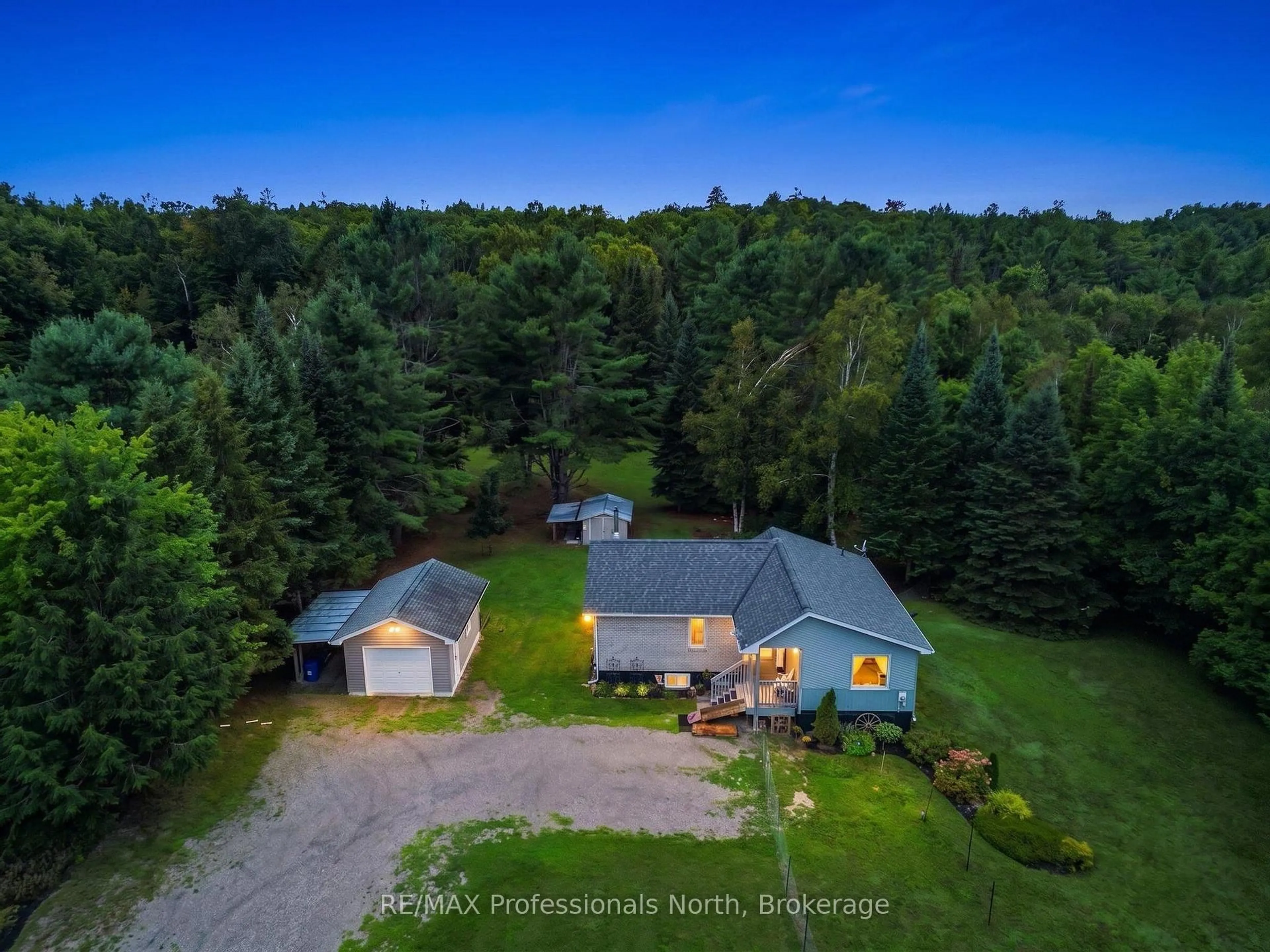 A pic from outside/outdoor area/front of a property/back of a property/a pic from drone, forest/trees view for 1297 Hunter Creek Rd, Minden Hills Ontario K0M 2K0