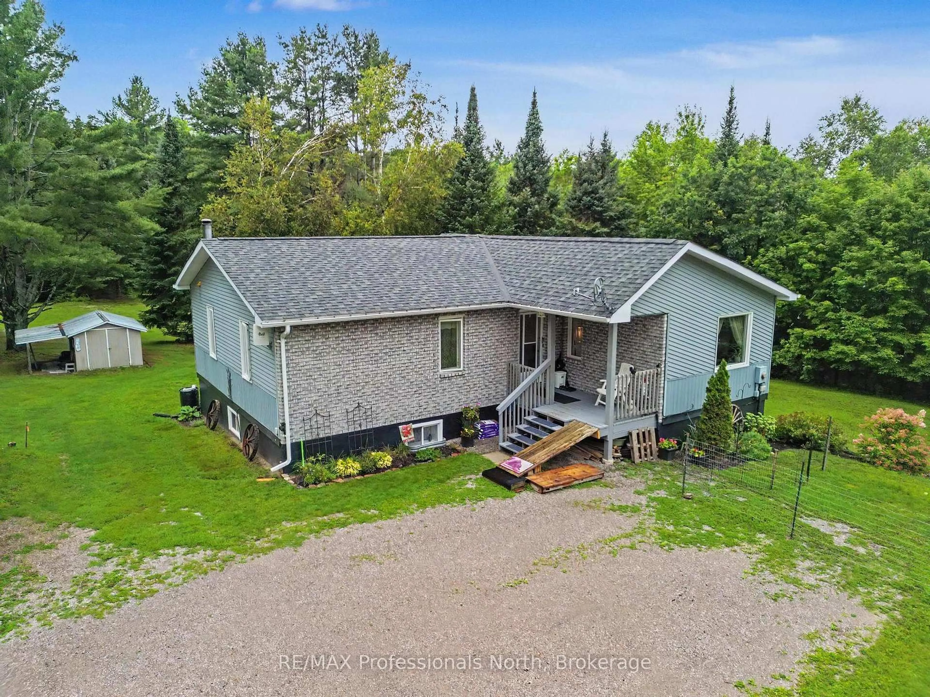 A pic from outside/outdoor area/front of a property/back of a property/a pic from drone, building for 1297 Hunter Creek Rd, Minden Hills Ontario K0M 2K0