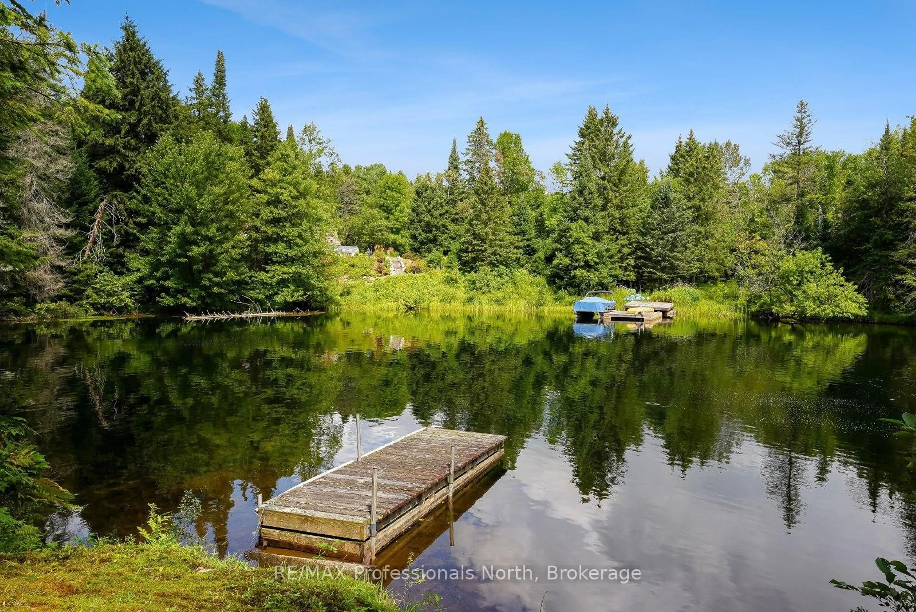 A pic from outside/outdoor area/front of a property/back of a property/a pic from drone, water/lake/river/ocean view for 1052 Ablett Crt, Algonquin Highlands Ontario K0M 1S0